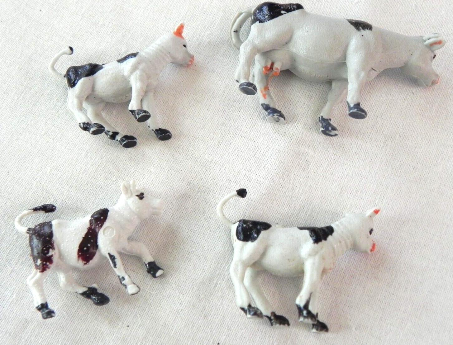 Set of 4 Holstein cows farm animals calves unknown vintage Singapore Hong