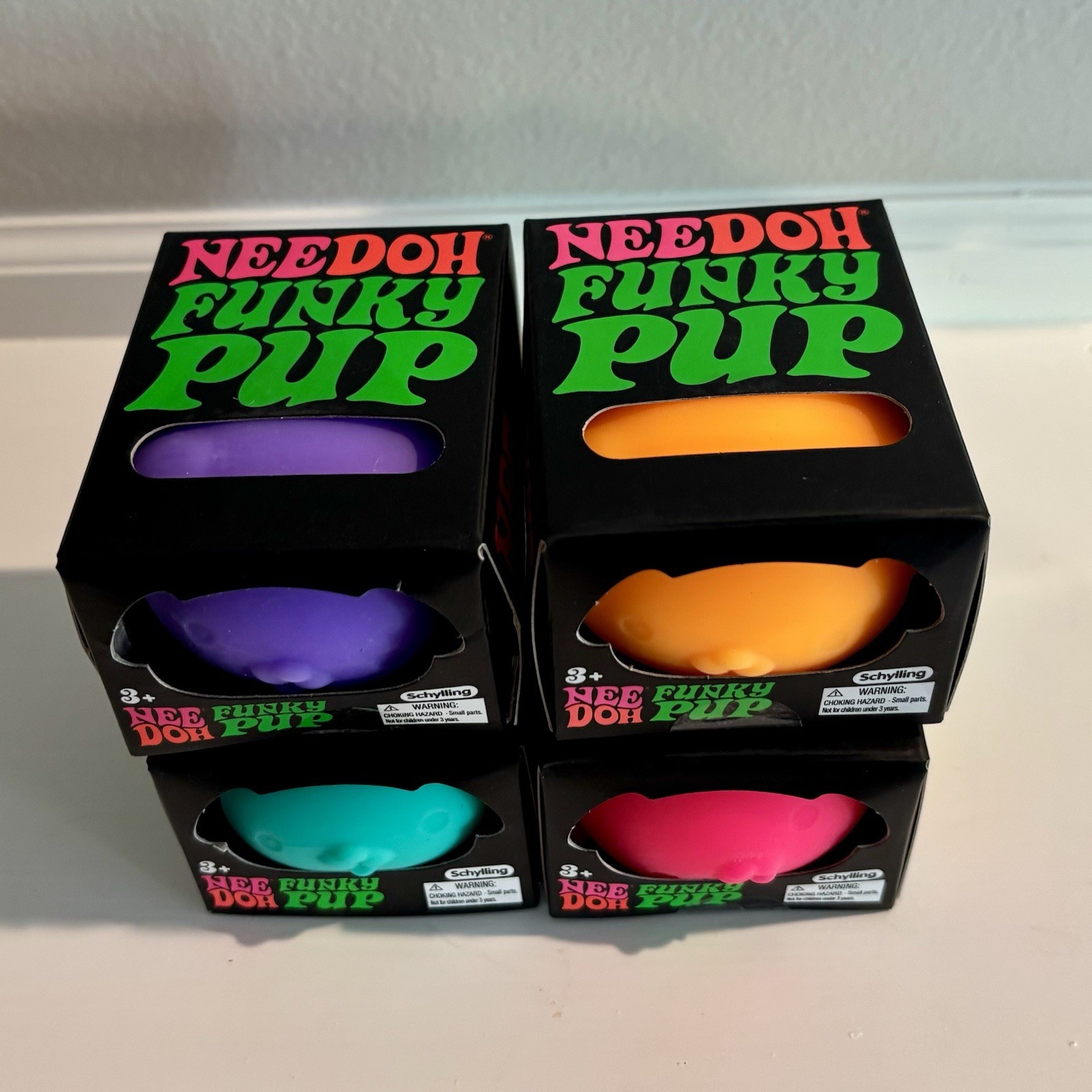 Needoh Funky Pup Toy Lot of 4 – Orange, Teal/Blue, Pink & Purple Schylling
