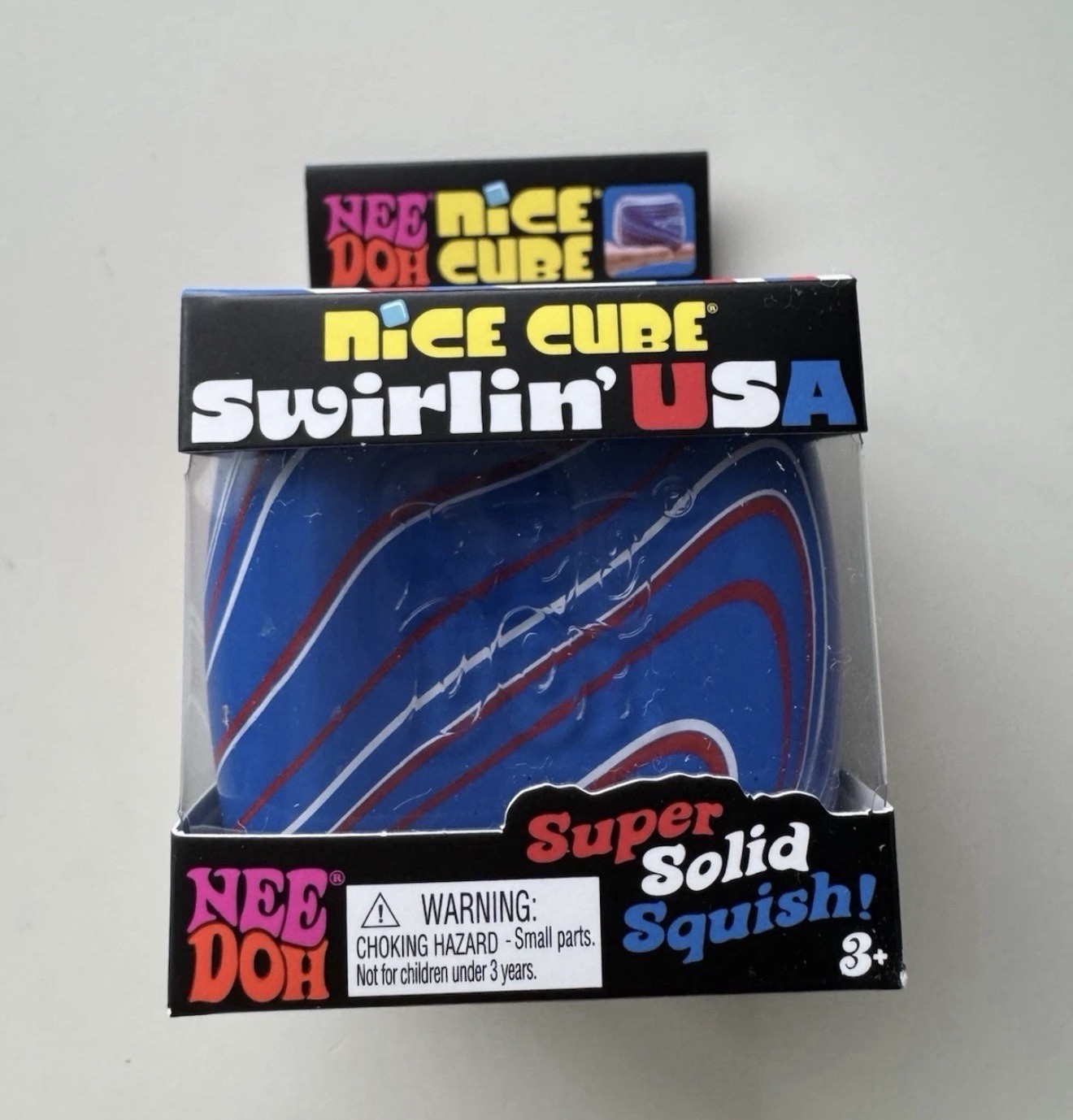 Nee Doh Nice Cube Swirlin’ USA Super Solid Squish Toy Blue Red White Squishy
