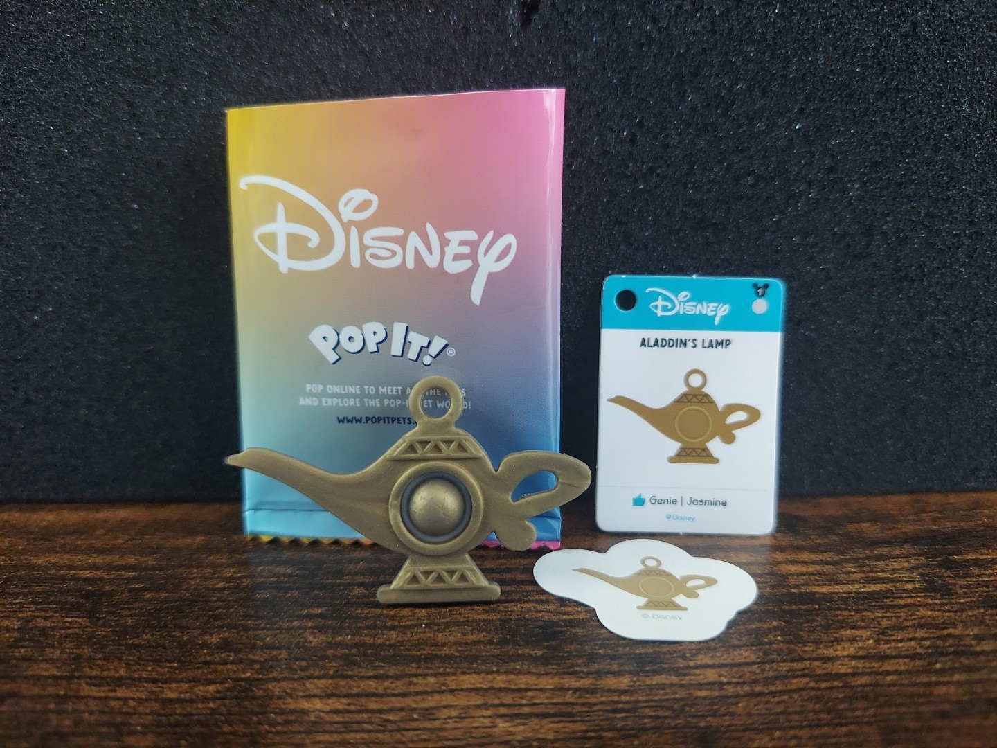 Disney Pop It! Mystery Bag Aladdin’s Lamp Mini Sensory Toy, Card, & Stickers