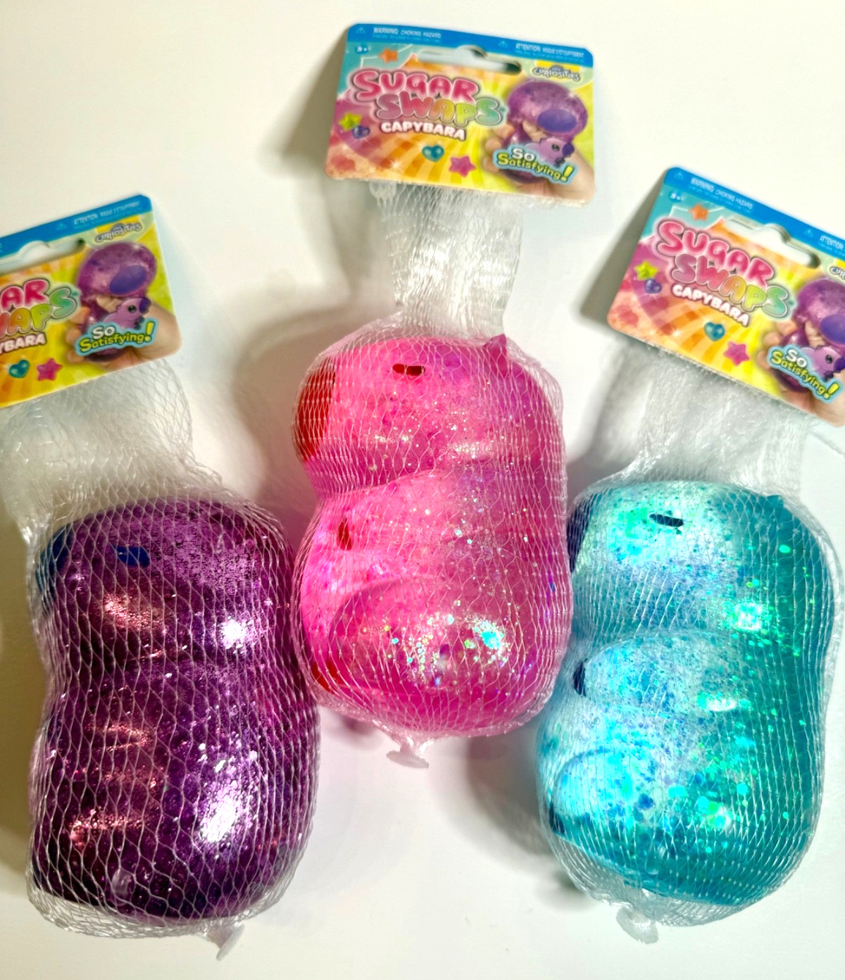 ORB Sugar Swaps CAPYBARA 🔥 LOT OF 3 – Purple, Pink & Blue Glitter Squishies