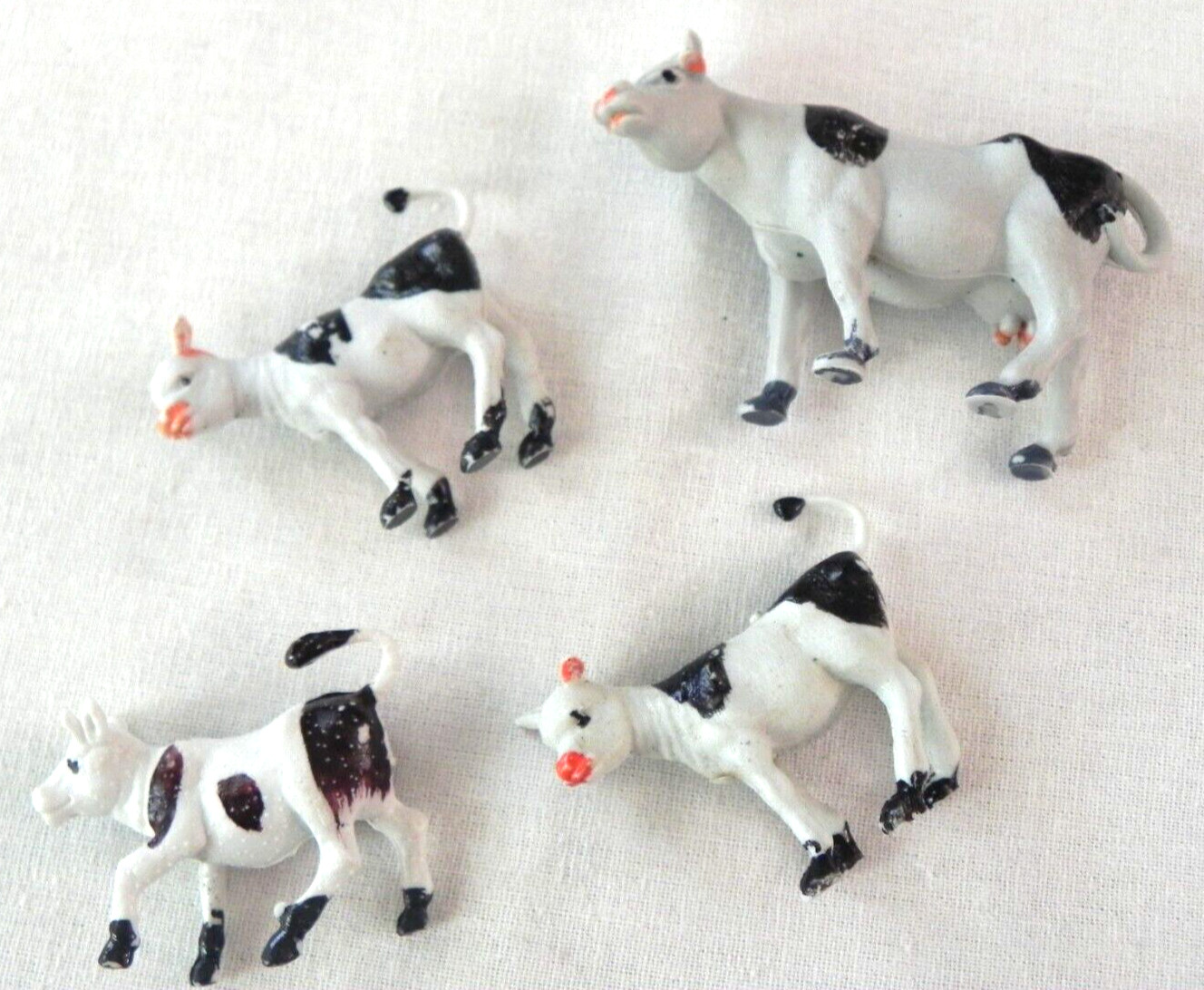 Set of 4 Holstein cows farm animals calves unknown vintage Singapore Hong