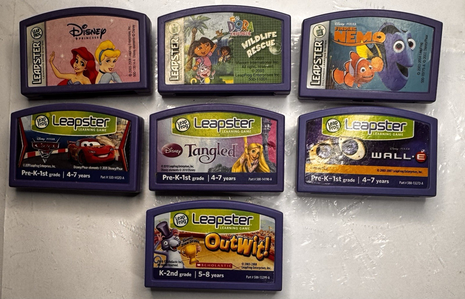 LeapFrog LEAPSTER LEARNING GAME LOT – 7 Cartridges – Dora Finding Nemo Tangled