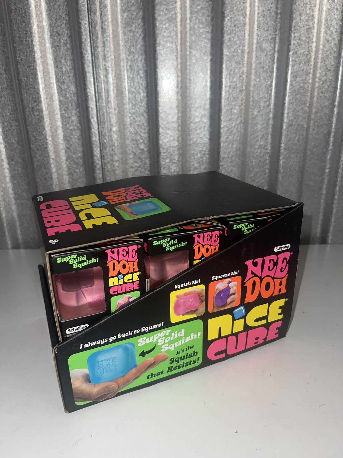 Lot Of (12) – Full Case NeeDoh Nice Cube Display – All 3 Colors