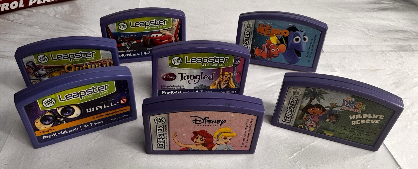 LeapFrog LEAPSTER LEARNING GAME LOT – 7 Cartridges – Dora Finding Nemo Tangled