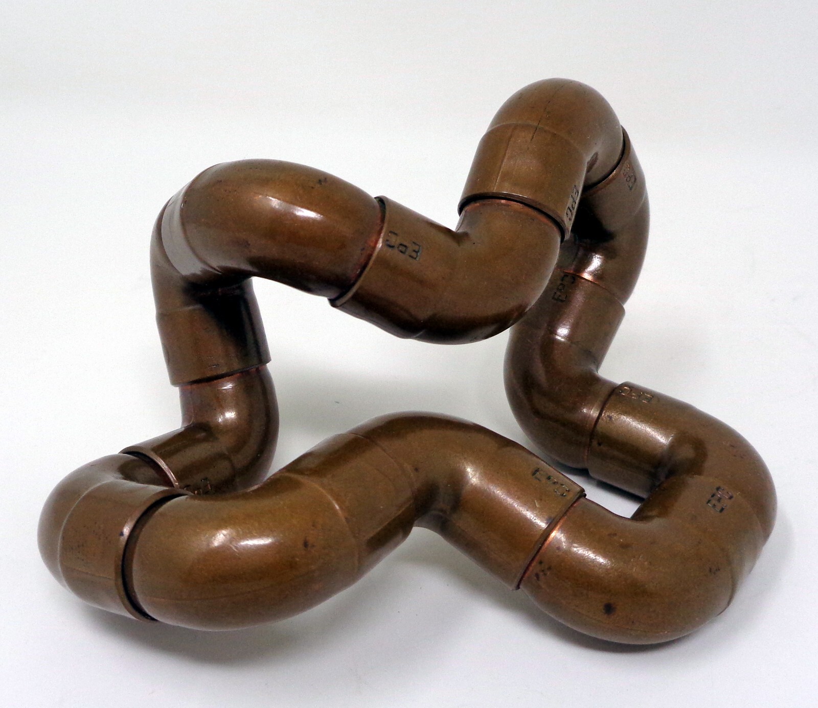 Metallic Bronze Twist In Many Shapes Toy
