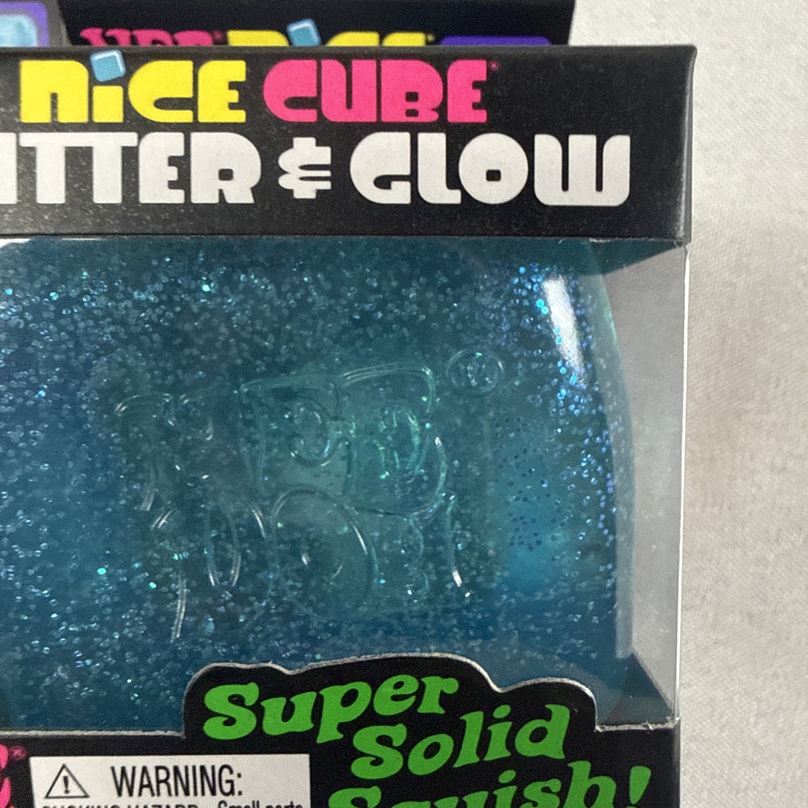 NeeDoh Nice Cube Glitter and Glow, Squishy, Glowing Ice Cube Pink And Blue