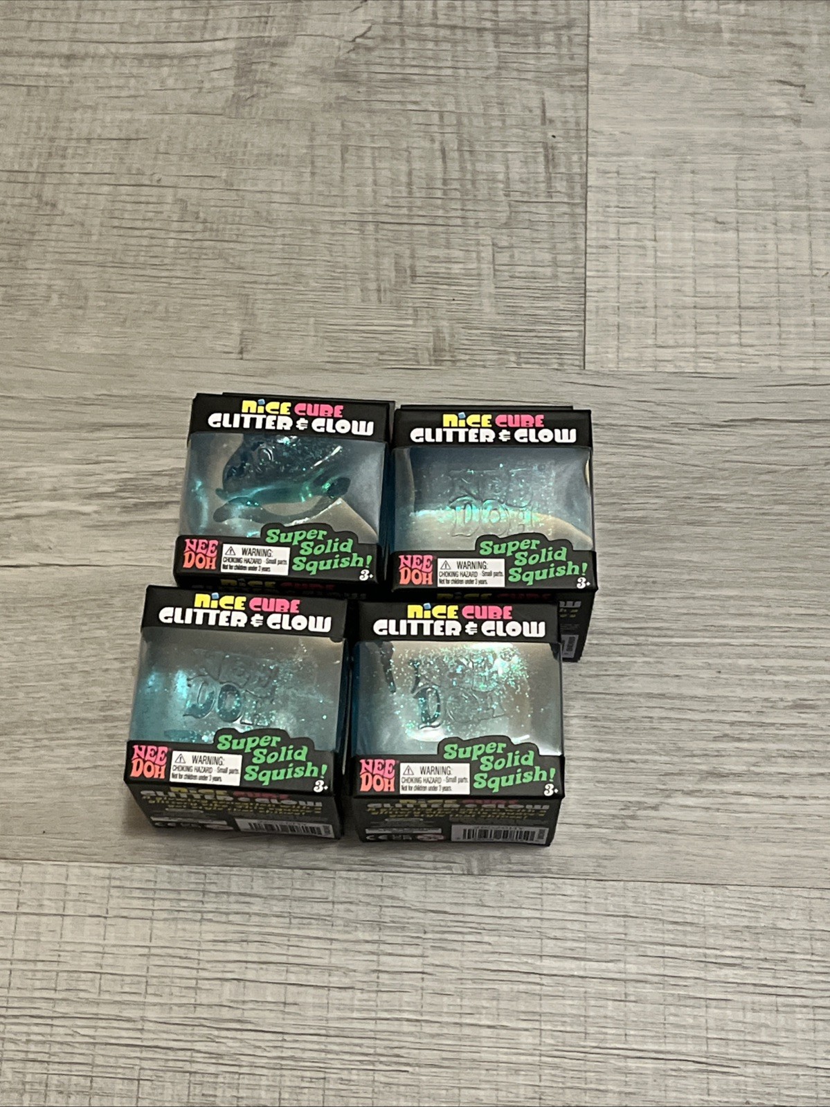 NeeDoh Nice Cube Glitter and Glow, Nee Doh Squishy, Glowing Ice Cube BLUE X4