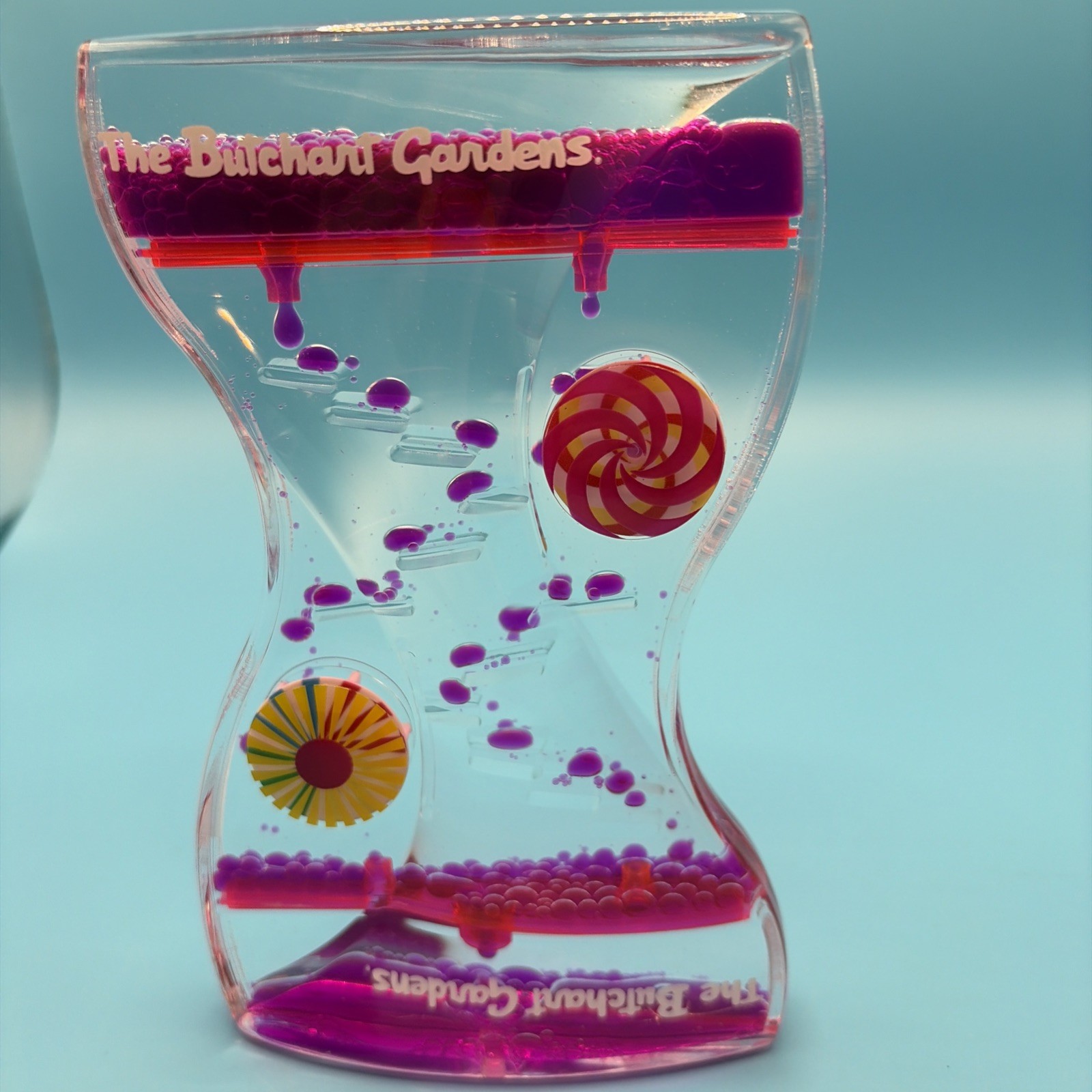 Liquid Motion Bubbler Timer The Butchart Gardens Drip Sensory Toy Pink Purple