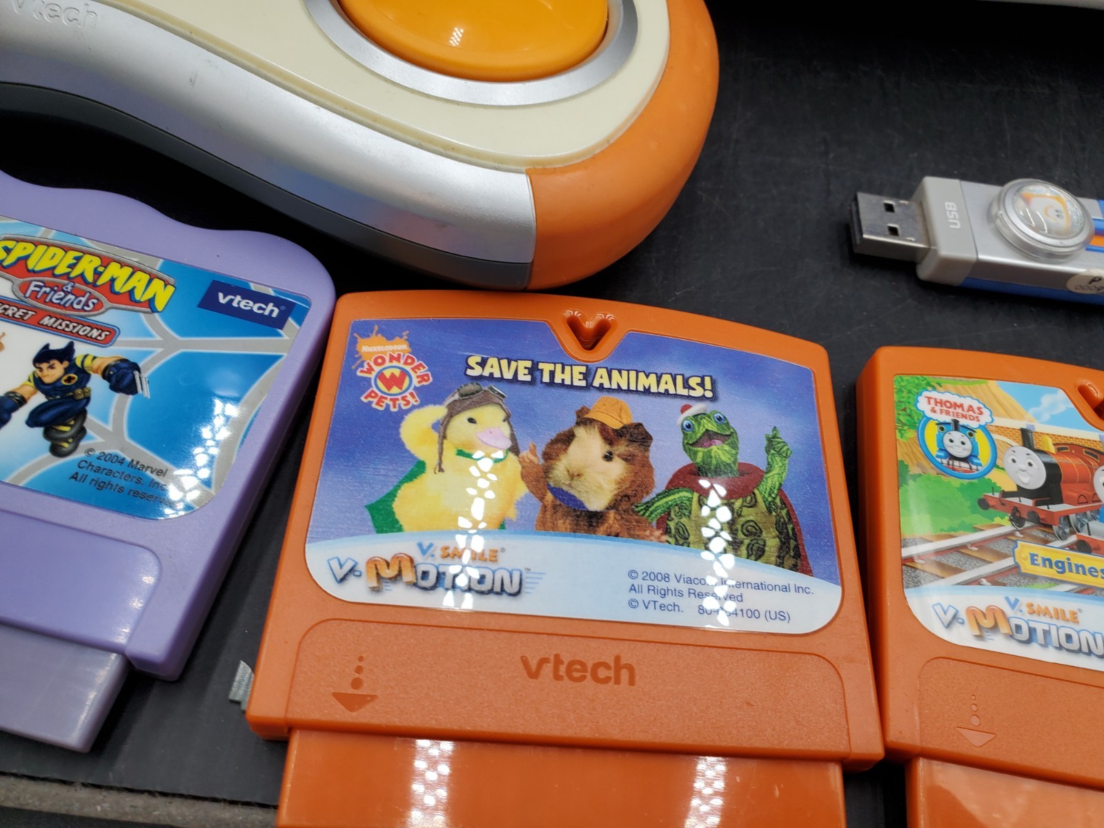 Vtech V.Smile V-Motion Active Learning Gray Console w/5 Cartridge game powers up
