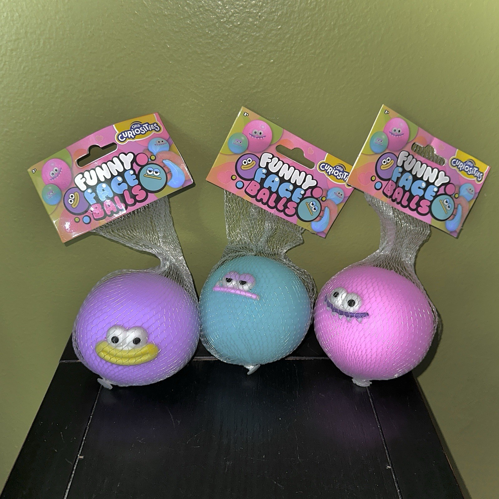 ORB TOYS Curiosities Funny Face Balls Purple, Teal, Pink Viral Squishy Sensory