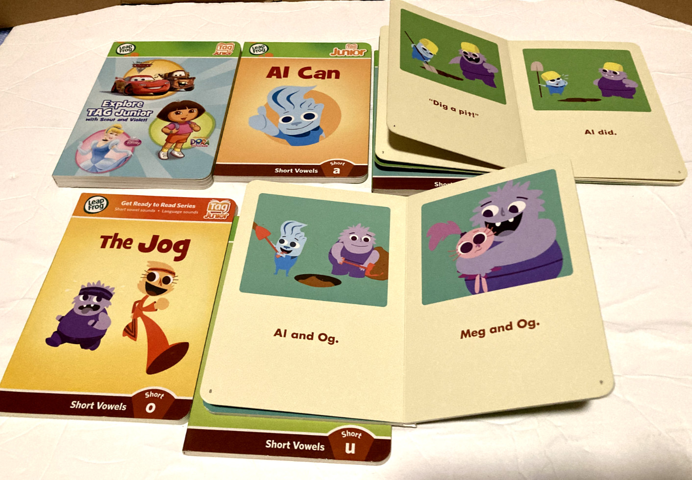Lot of 7 Leapfrog Tag Junior Short Vowel Sounds and Explore Tag Junior Books