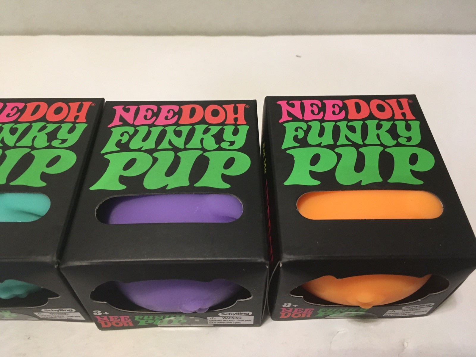 NeeDoh Schylling Funky Pup Fidget Toy Lot of 4 Pink Purple Teal & Orange