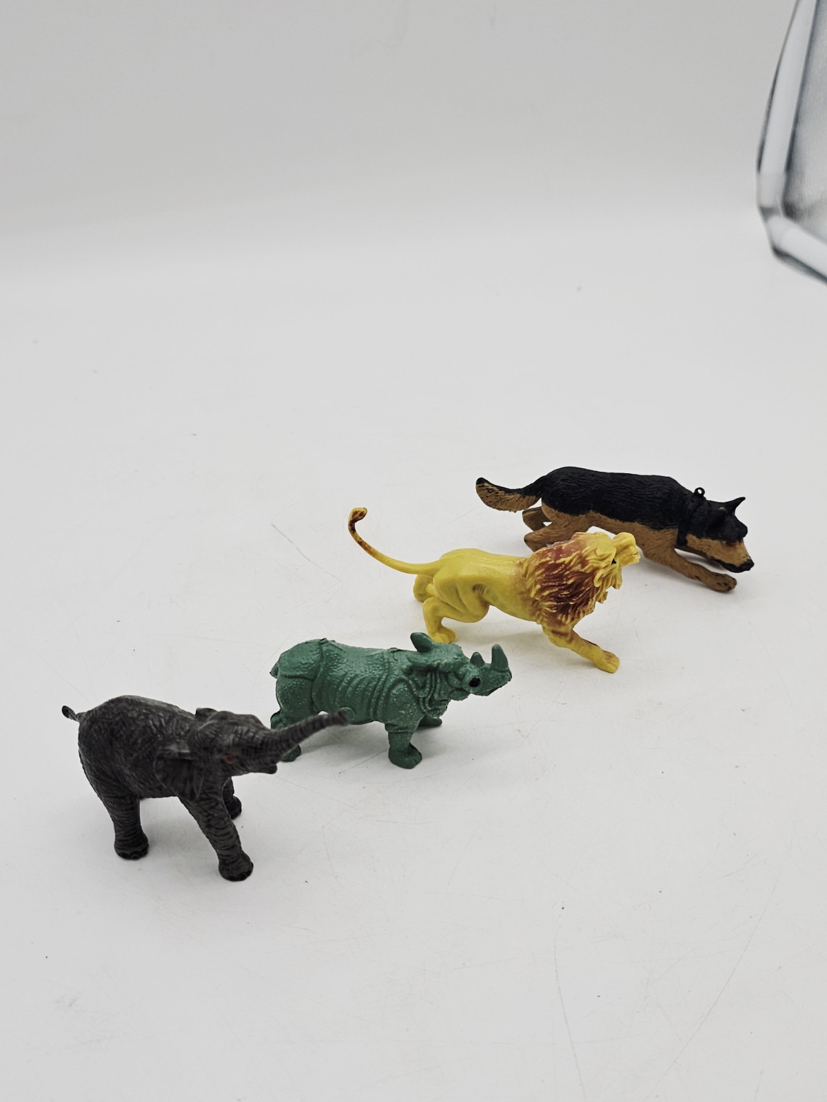 Lot of 4 Plastic Toy Animals Figures Lion Elephant Wild Dog 3.5″ long appx.