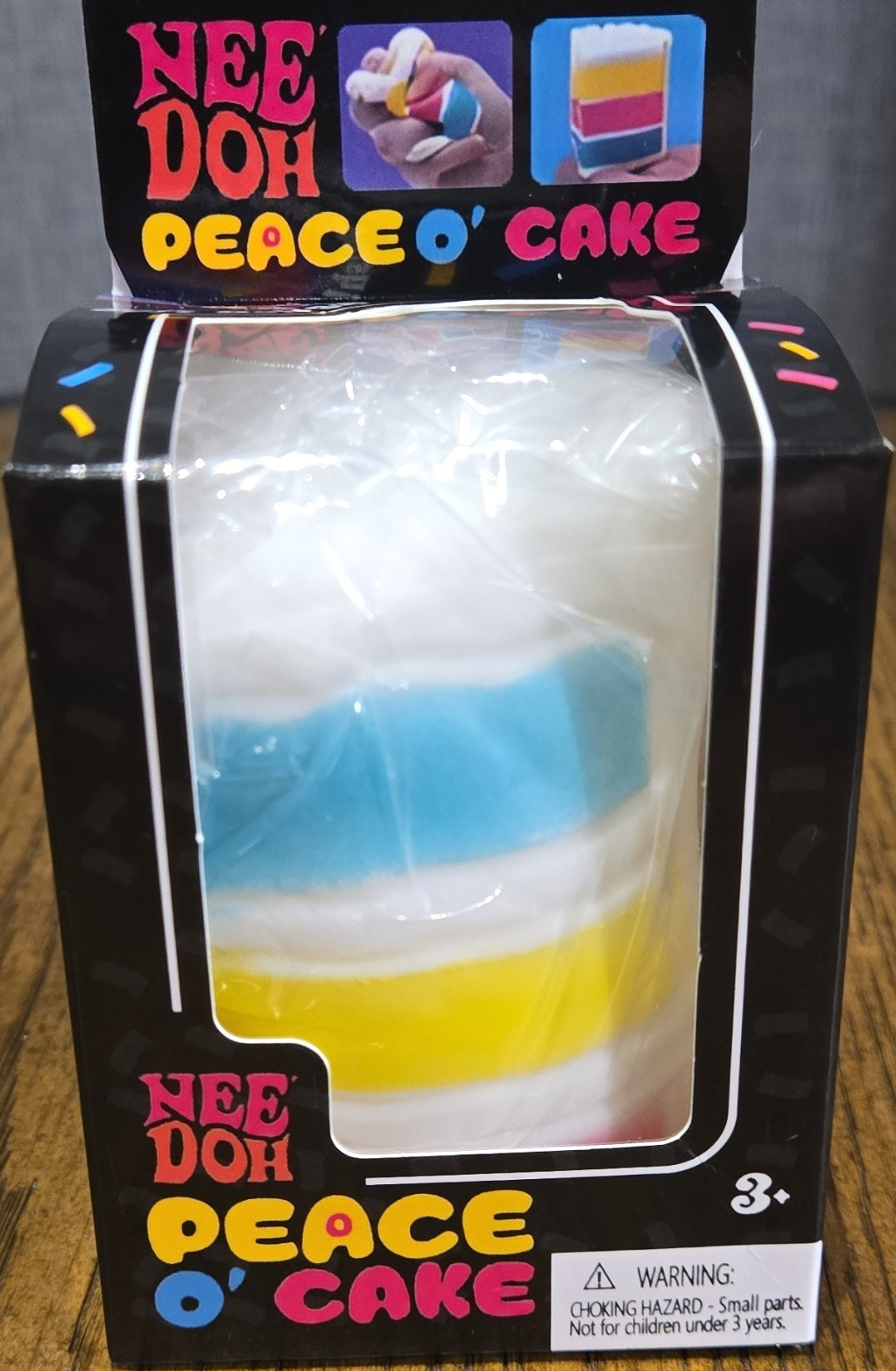 Nee Doh Peace O’ Cake Squeeze Sensory Toy White Blue Yellow Ages 3-11 3+ Years