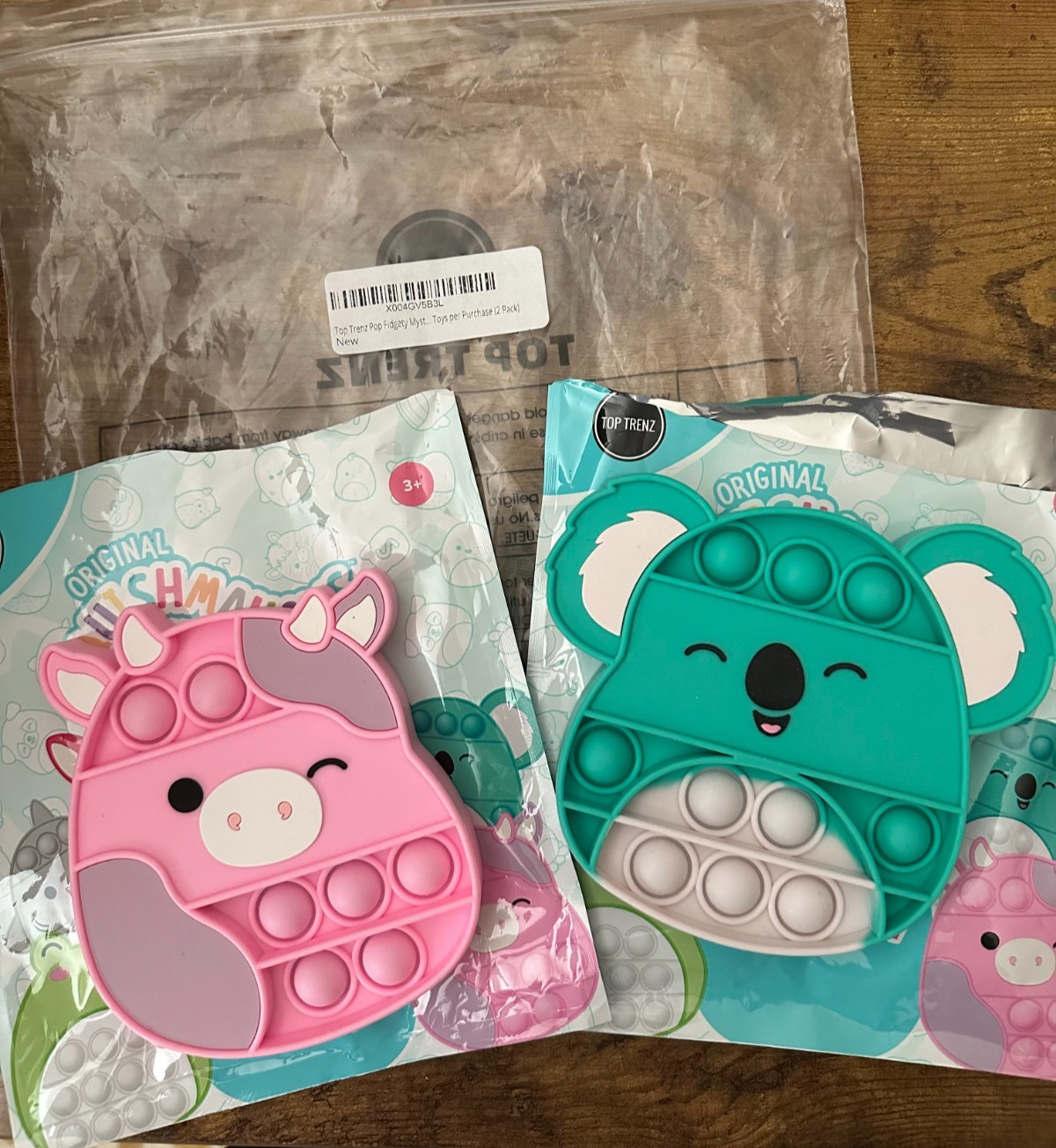 2 Pieces – Squishmellows Fidget Pop Toy – Cow & Koala – Opened bag