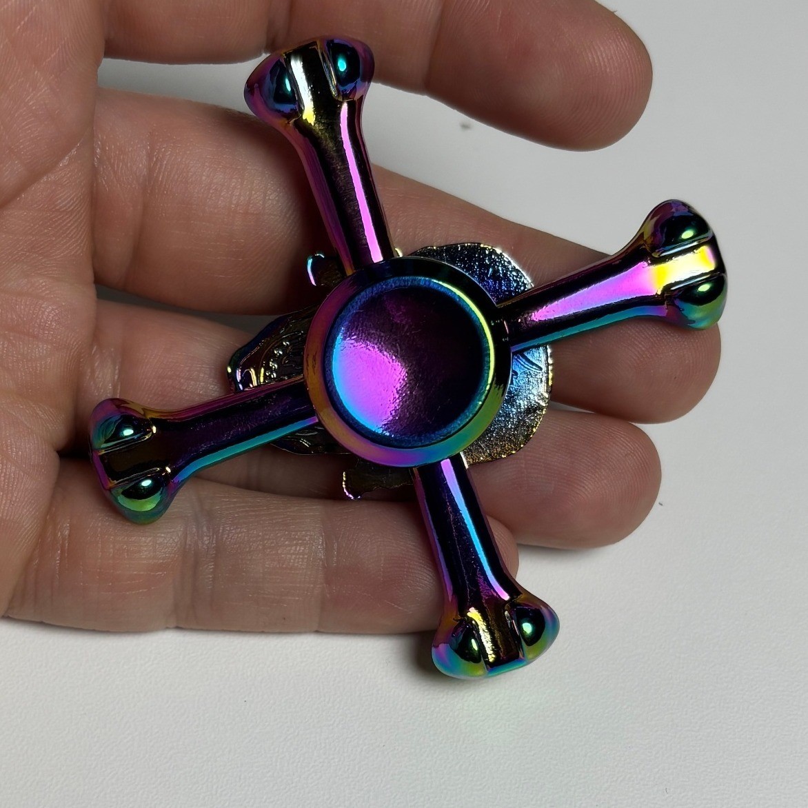 Iridescent Skull and Crossbones Metal Fidget Spinner Rainbow Oil Slick Finish