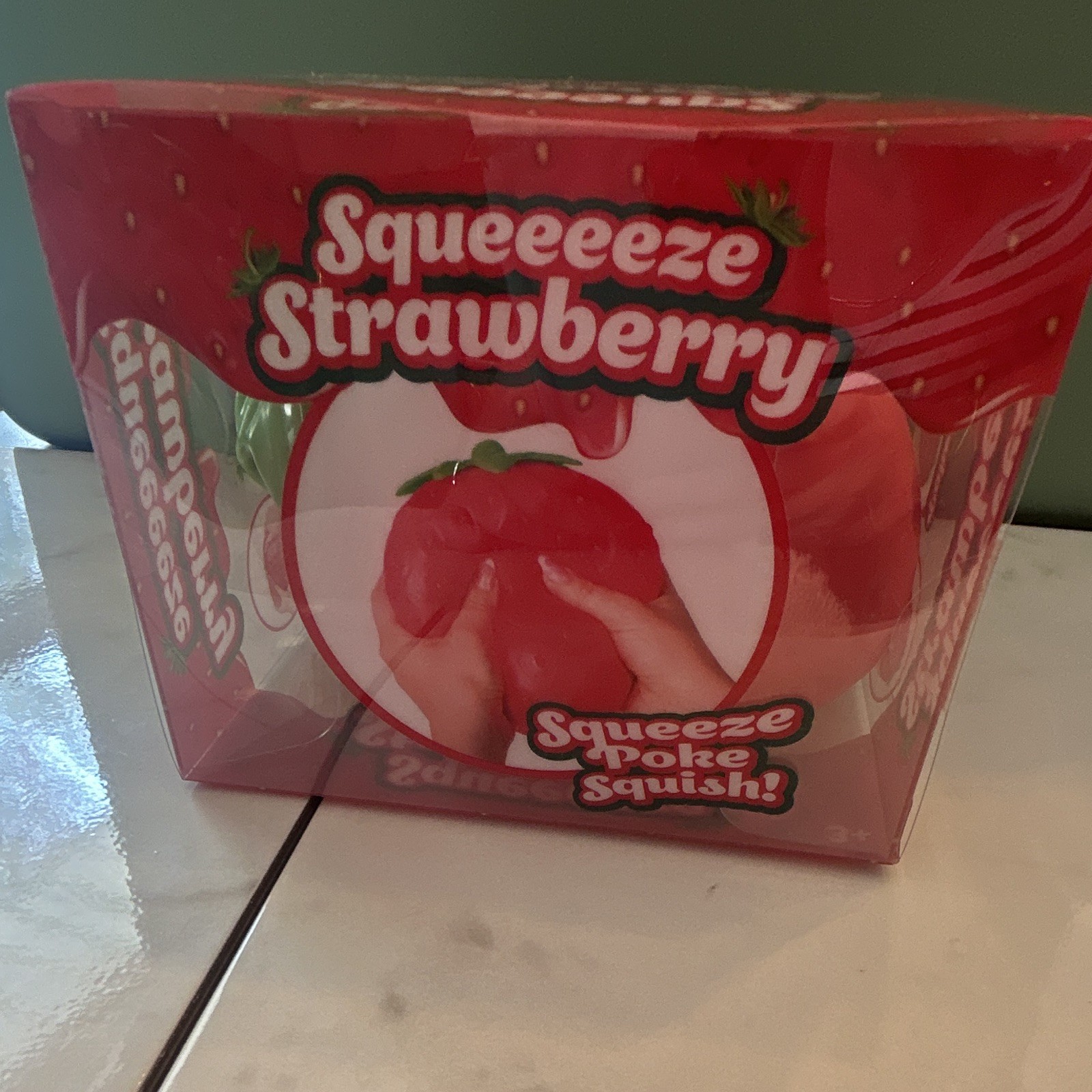 Sunny Days Squeeeeze Strawberry Gel Tactile Squeeze Toy Red/Green Squishy