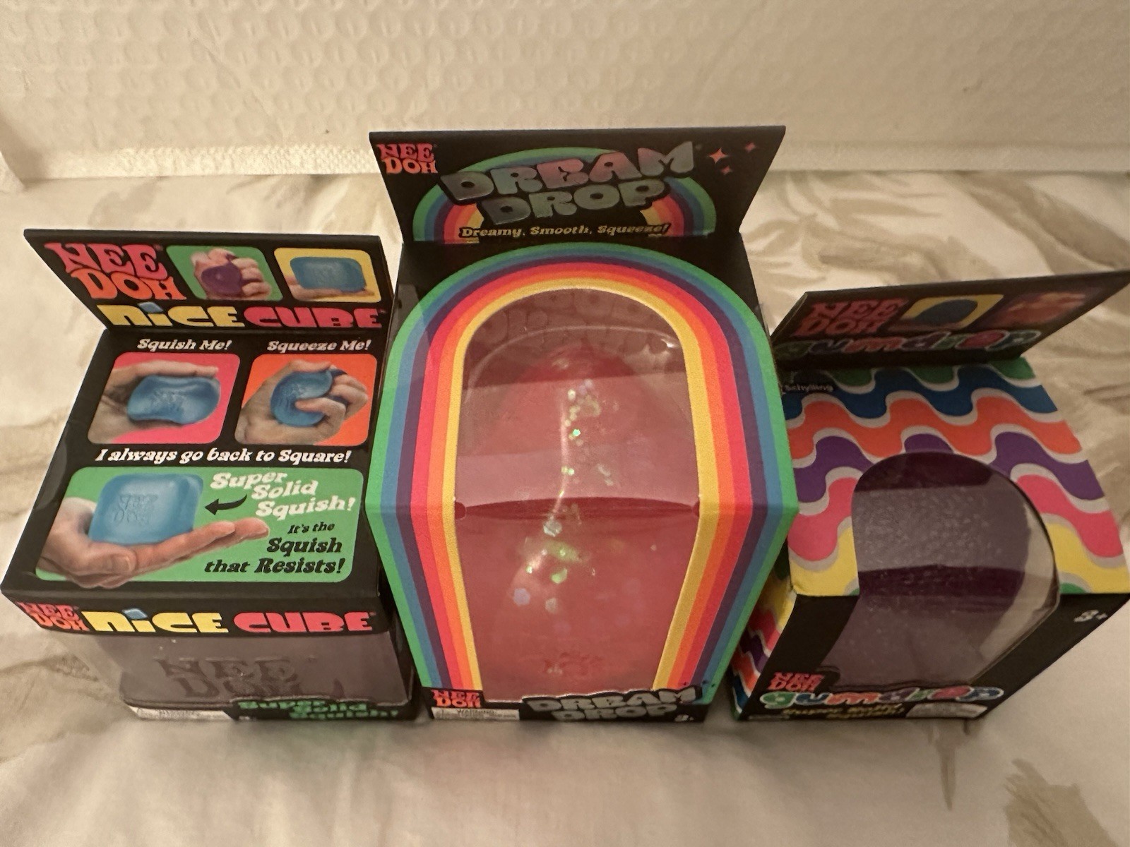 Needoh Lot Of 3 – Purple Gumdrop, Pink Dream Drop, Purple Nice Cube Squishy Set