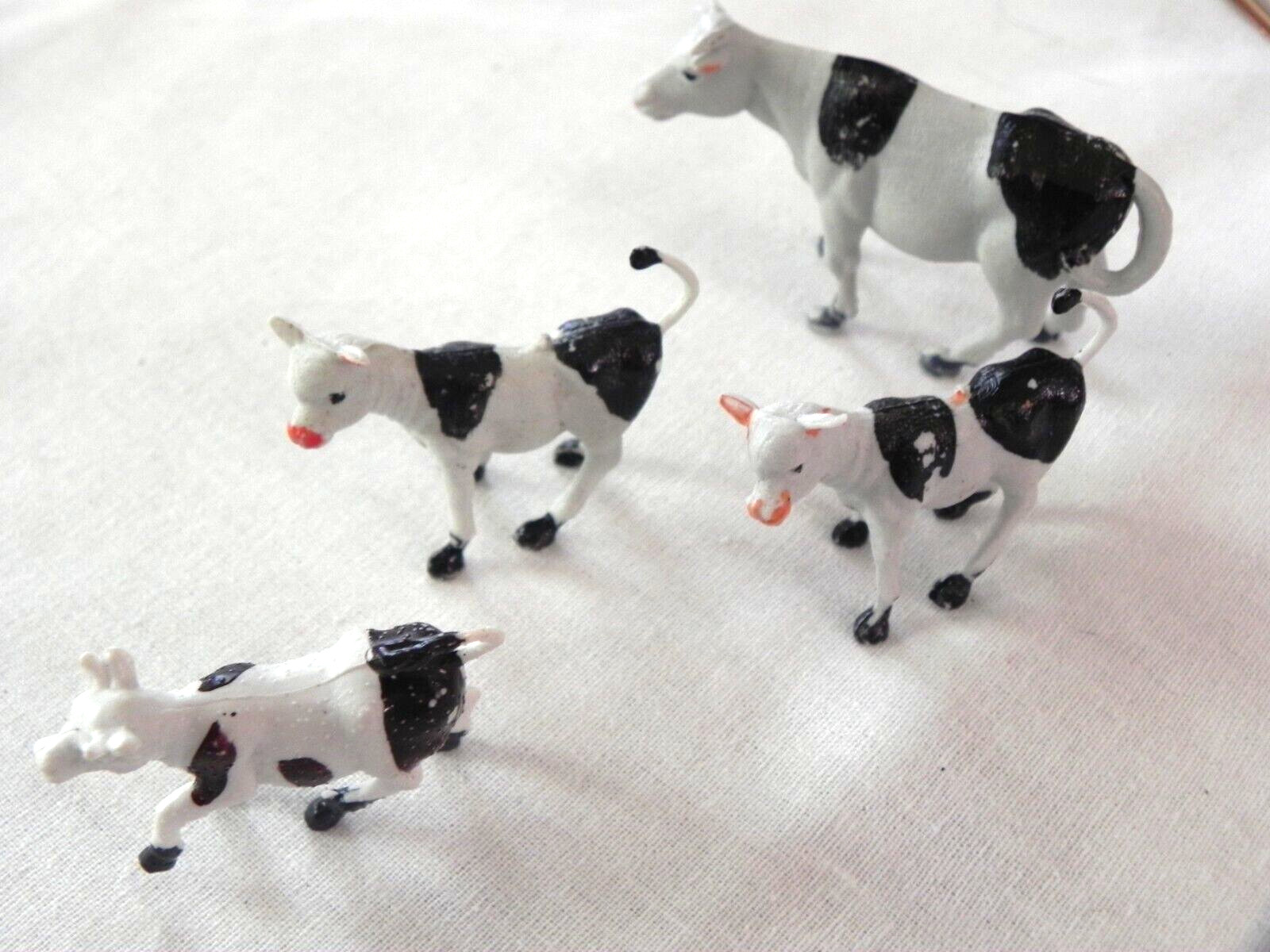 Set of 4 Holstein cows farm animals calves unknown vintage Singapore Hong