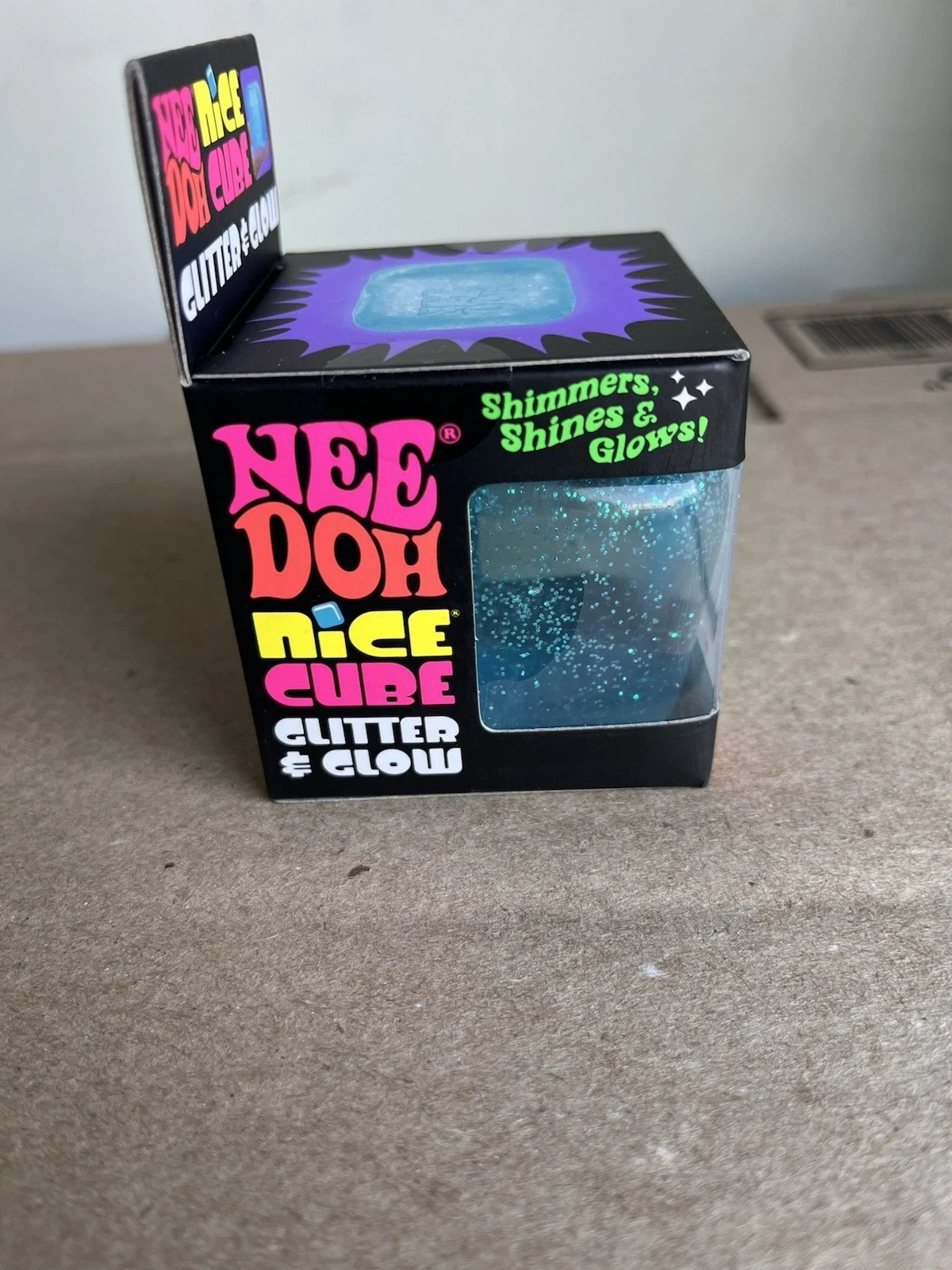 NeeDoh Nice Cube Glitter and Glow Nee Doh Squishy Glowing Ice Schilling Toy BLUE