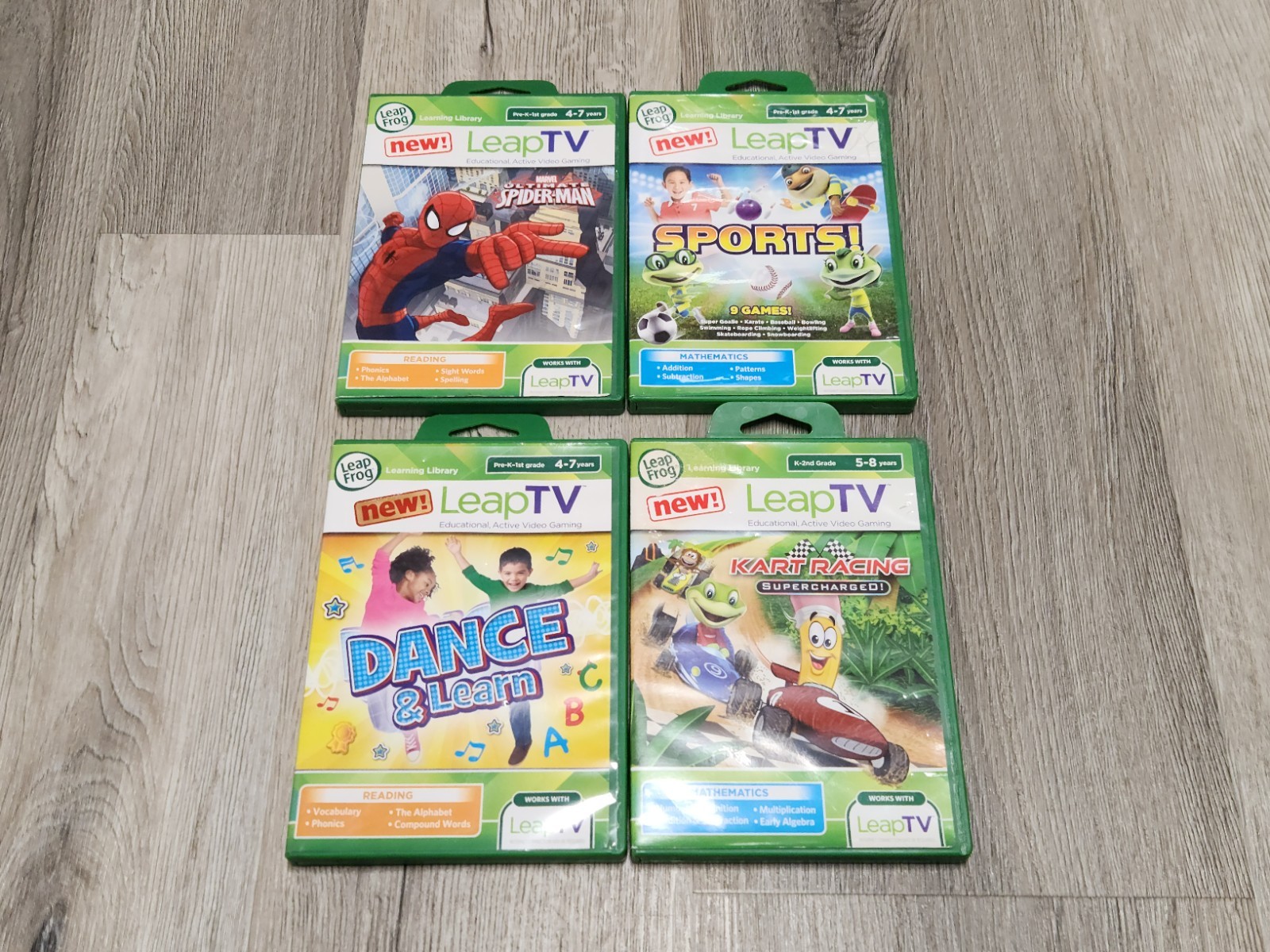 Lot of 4 LeapFrog LeapTV Games – Spider Man, Sports,Dance & Learn, Kart Racing