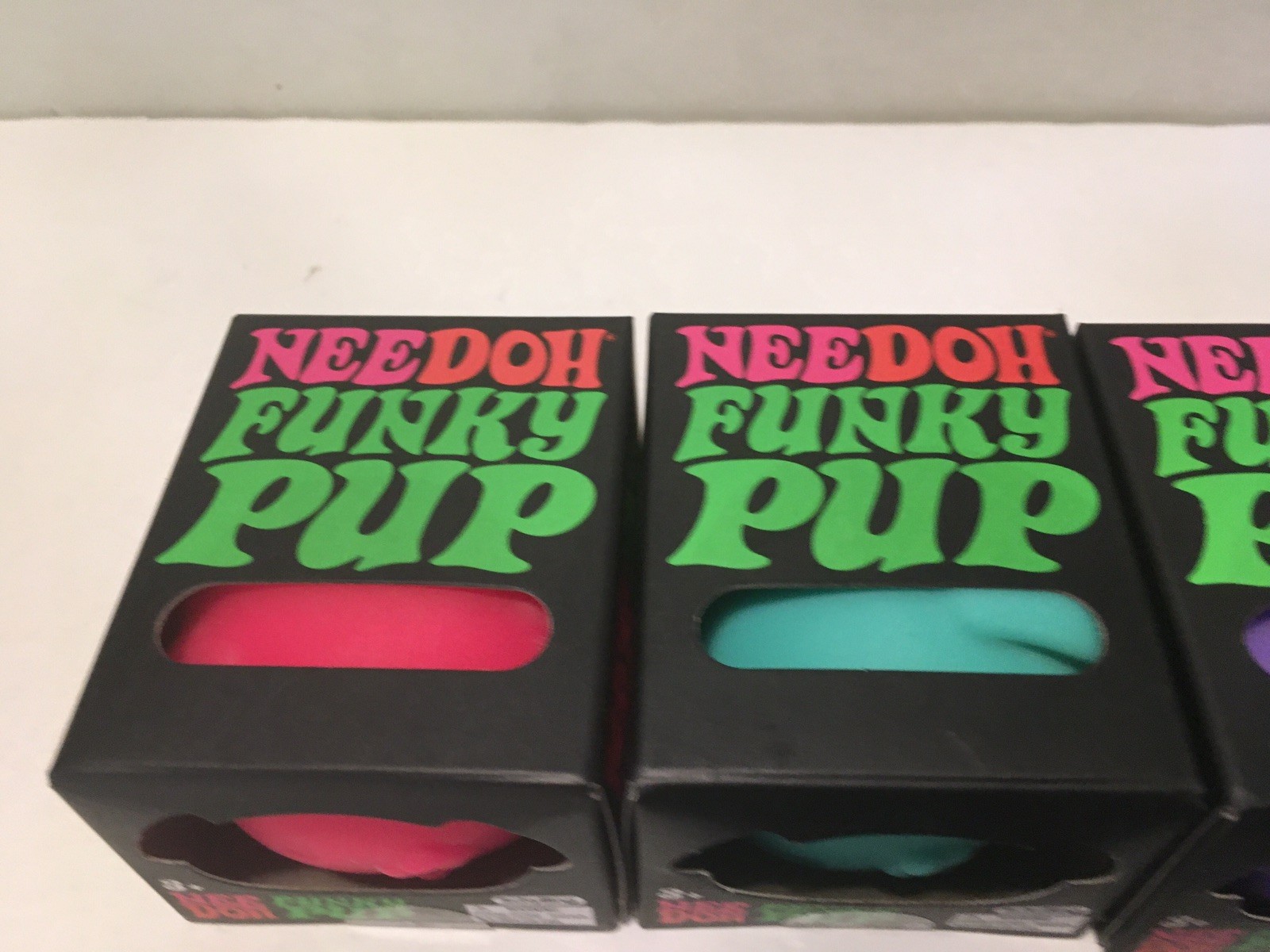 NeeDoh Schylling Funky Pup Fidget Toy Lot of 4 Pink Purple Teal & Orange