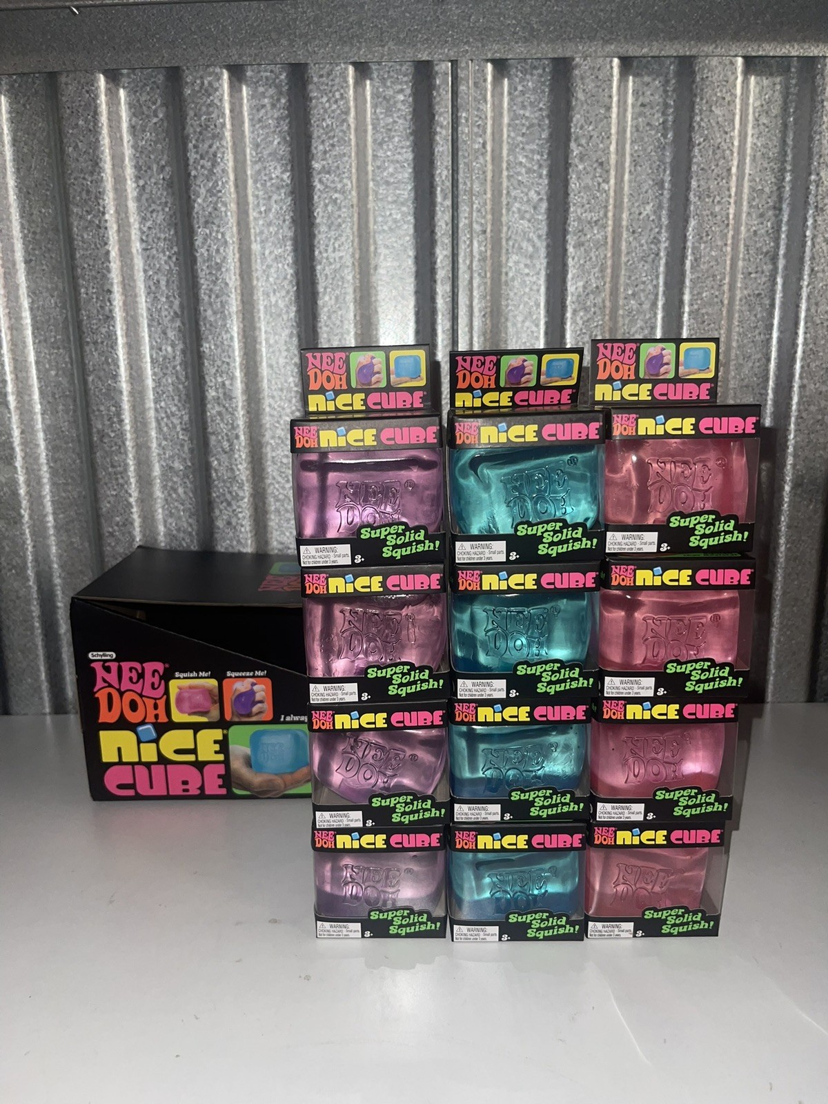 Lot Of (12) – Full Case NeeDoh Nice Cube Display – All 3 Colors