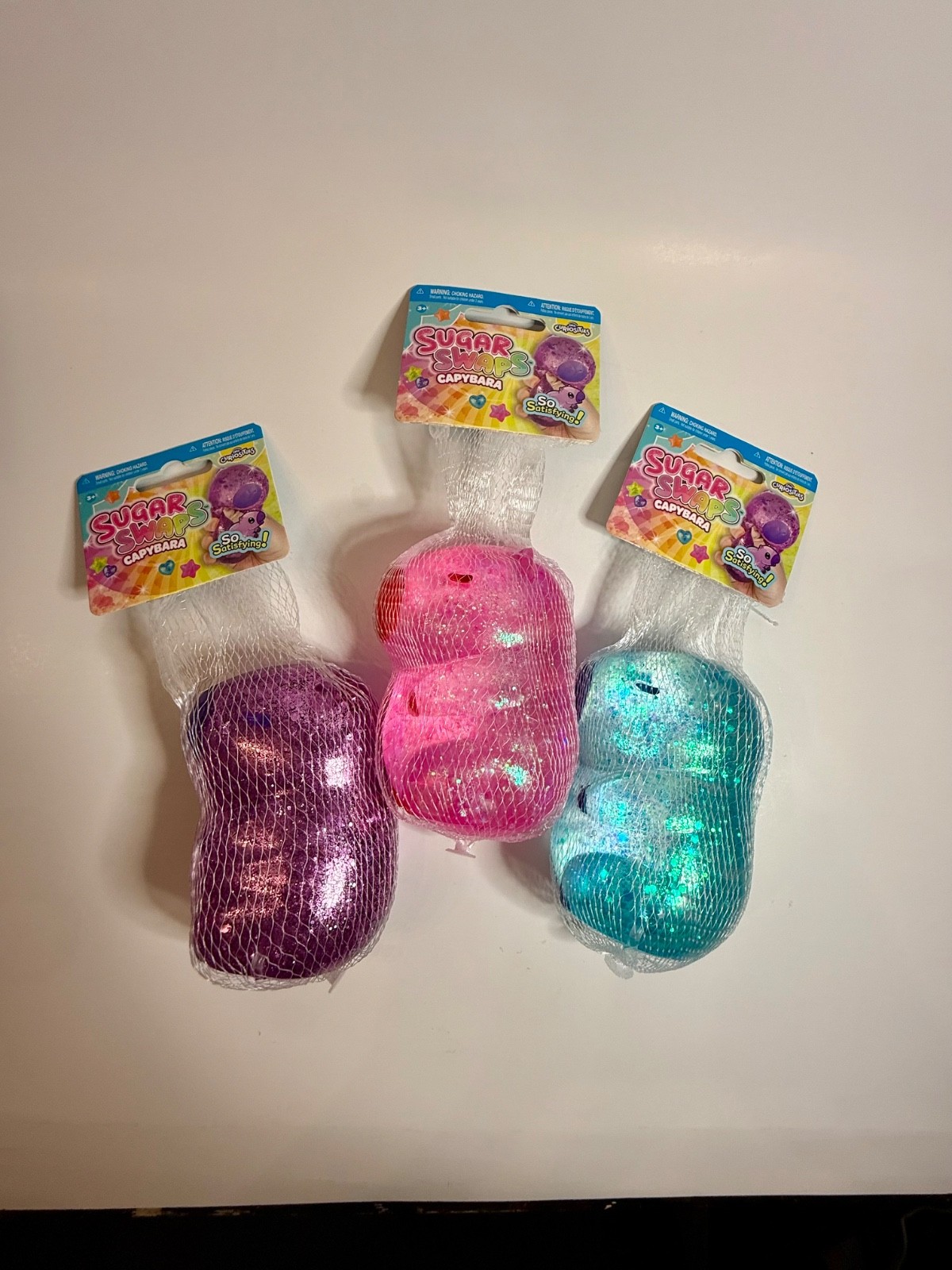 ORB Sugar Swaps CAPYBARA 🔥 LOT OF 3 – Purple, Pink & Blue Glitter Squishies