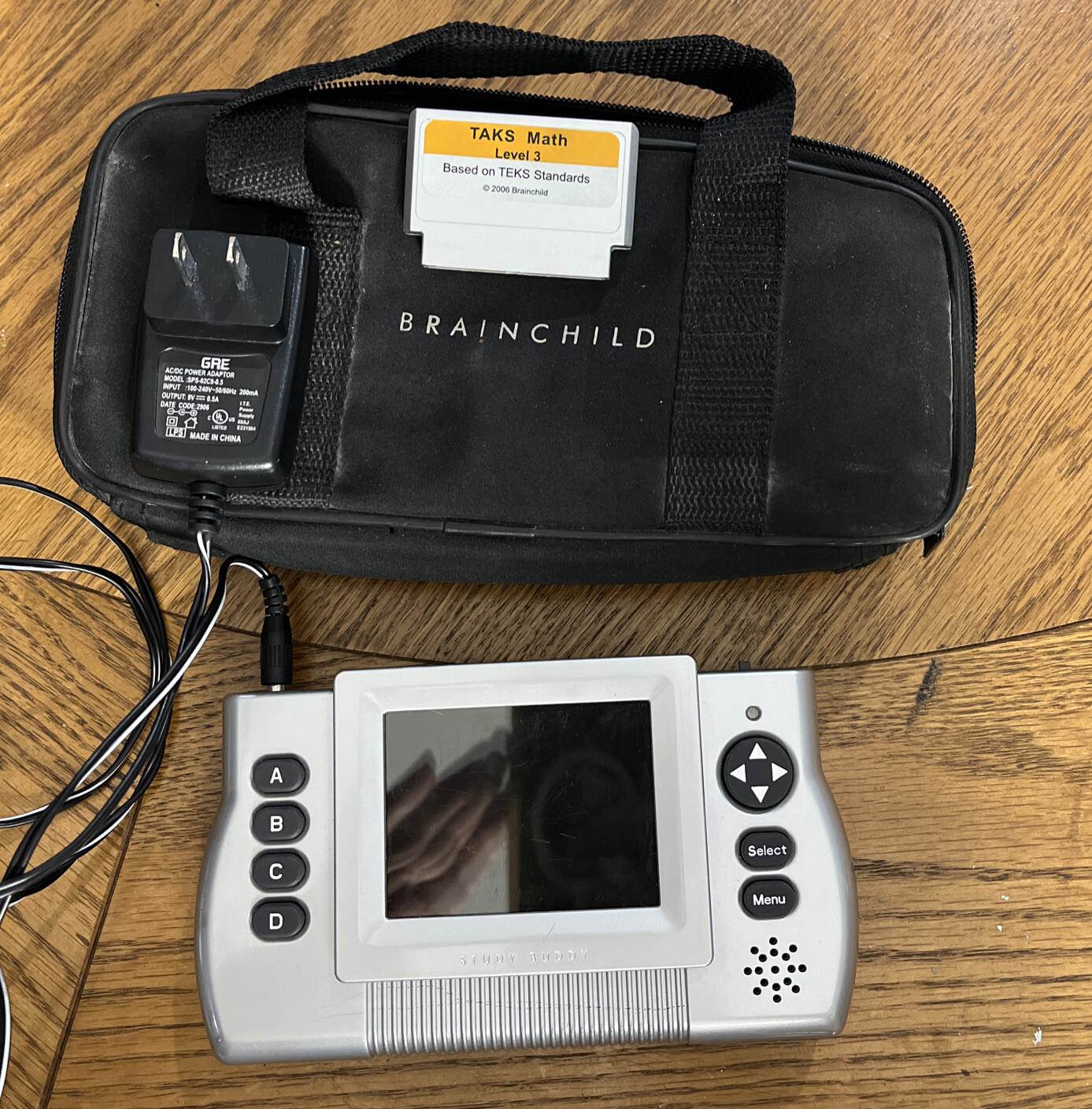 BRAIN CHILD STUDY BUDDY CONSOLES W/TAKS MATH AND CHARGER & BAG