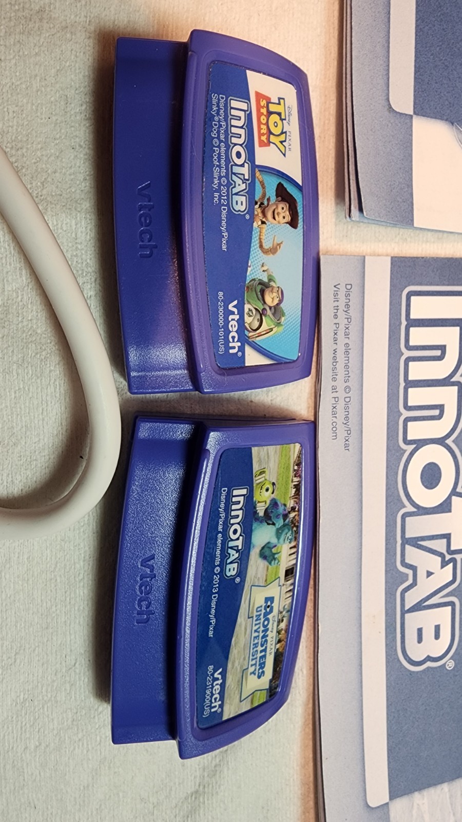 Lot Of 2 Vtech Innotab Games Toy Story and Monsters University, Untested, Cable