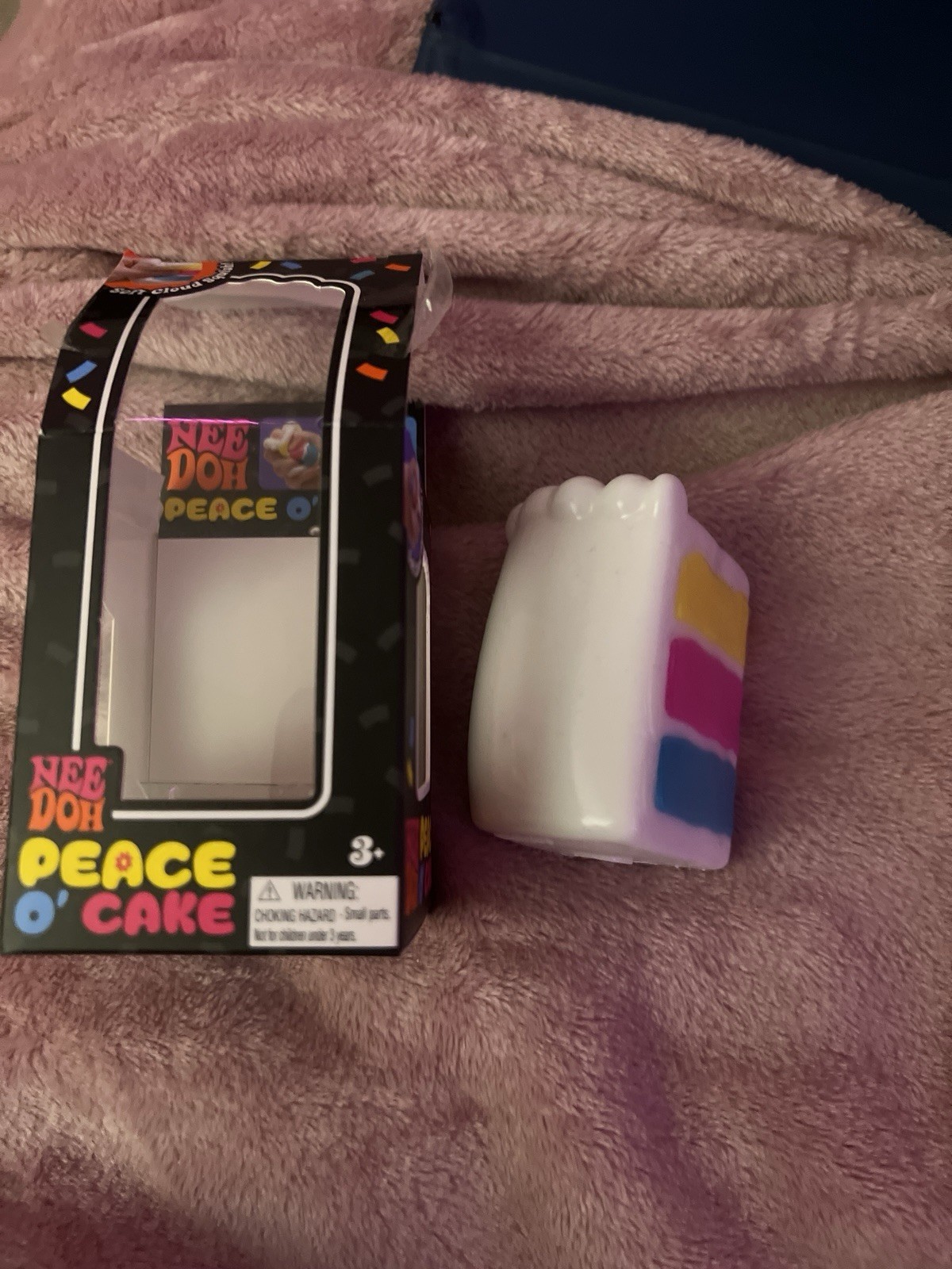Nee Doh Peace O’ Cake Tactile Squeeze Toy Multicolor White Yellow Pink Blue
