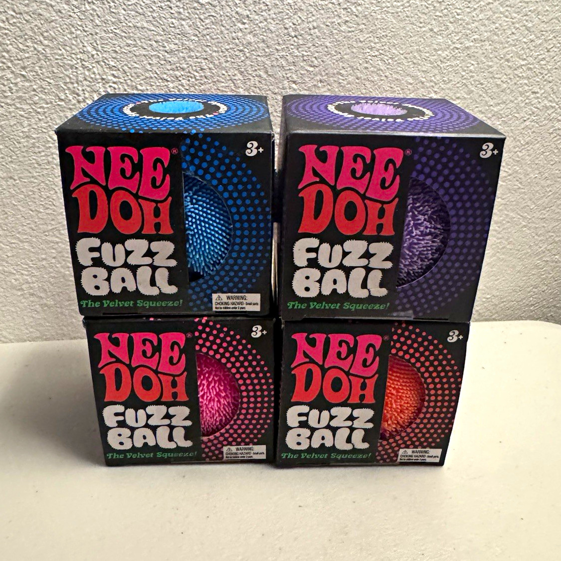 Nee Doh Fuzz Ball Velvet Squeeze 4-Pack, Blue/Purple/Pink/Orange, Ages 3+