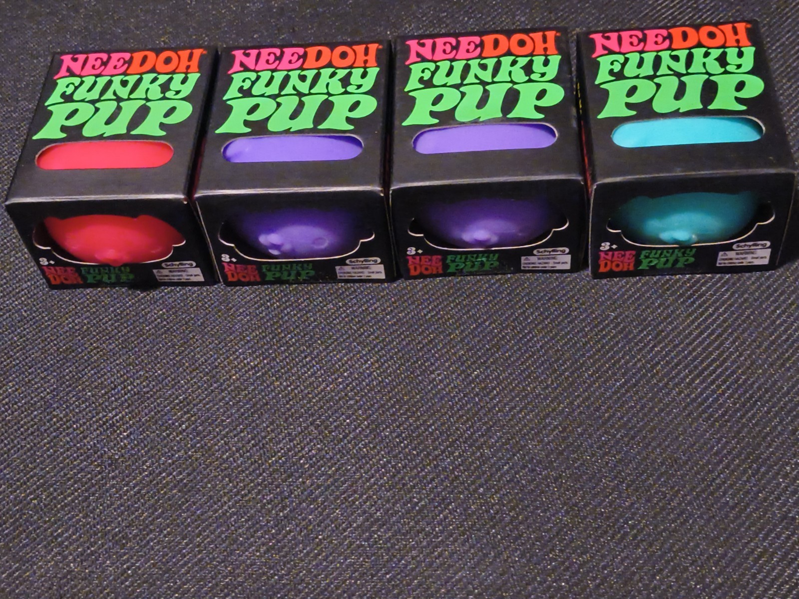 Schylling NeeDoh Funky Pup – Lot of 4 100% Authentic. Purple X2, Teal, Pink