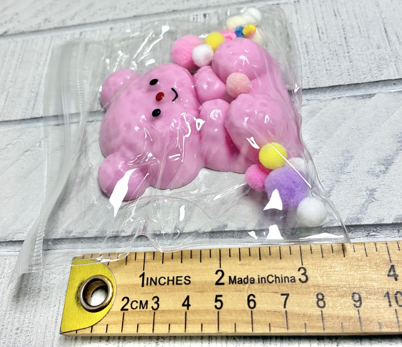 Squishy Toy Cute Pink Teddy Bear With Colorful Pom Poms In Clear Resealable Bag