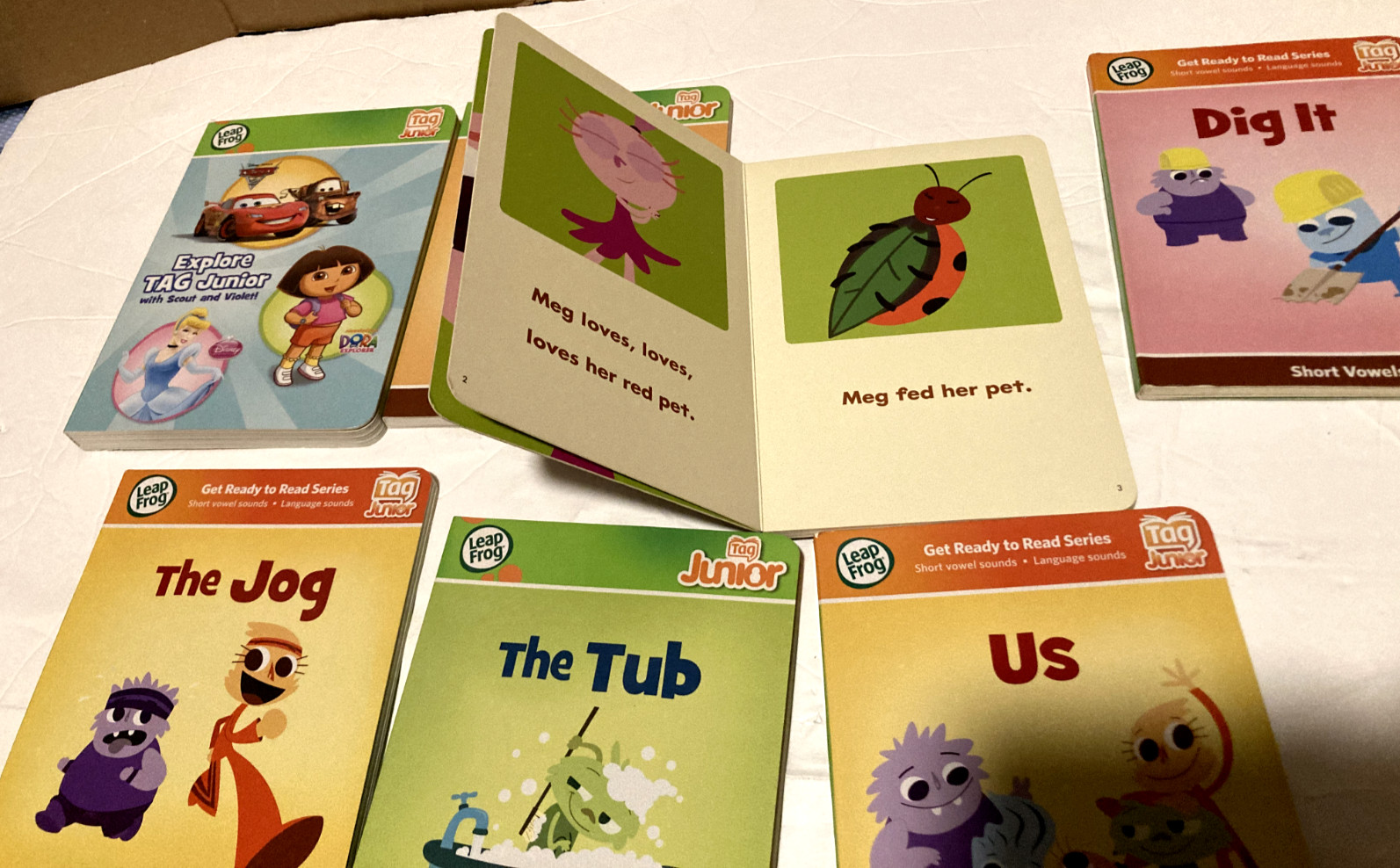Lot of 7 Leapfrog Tag Junior Short Vowel Sounds and Explore Tag Junior Books