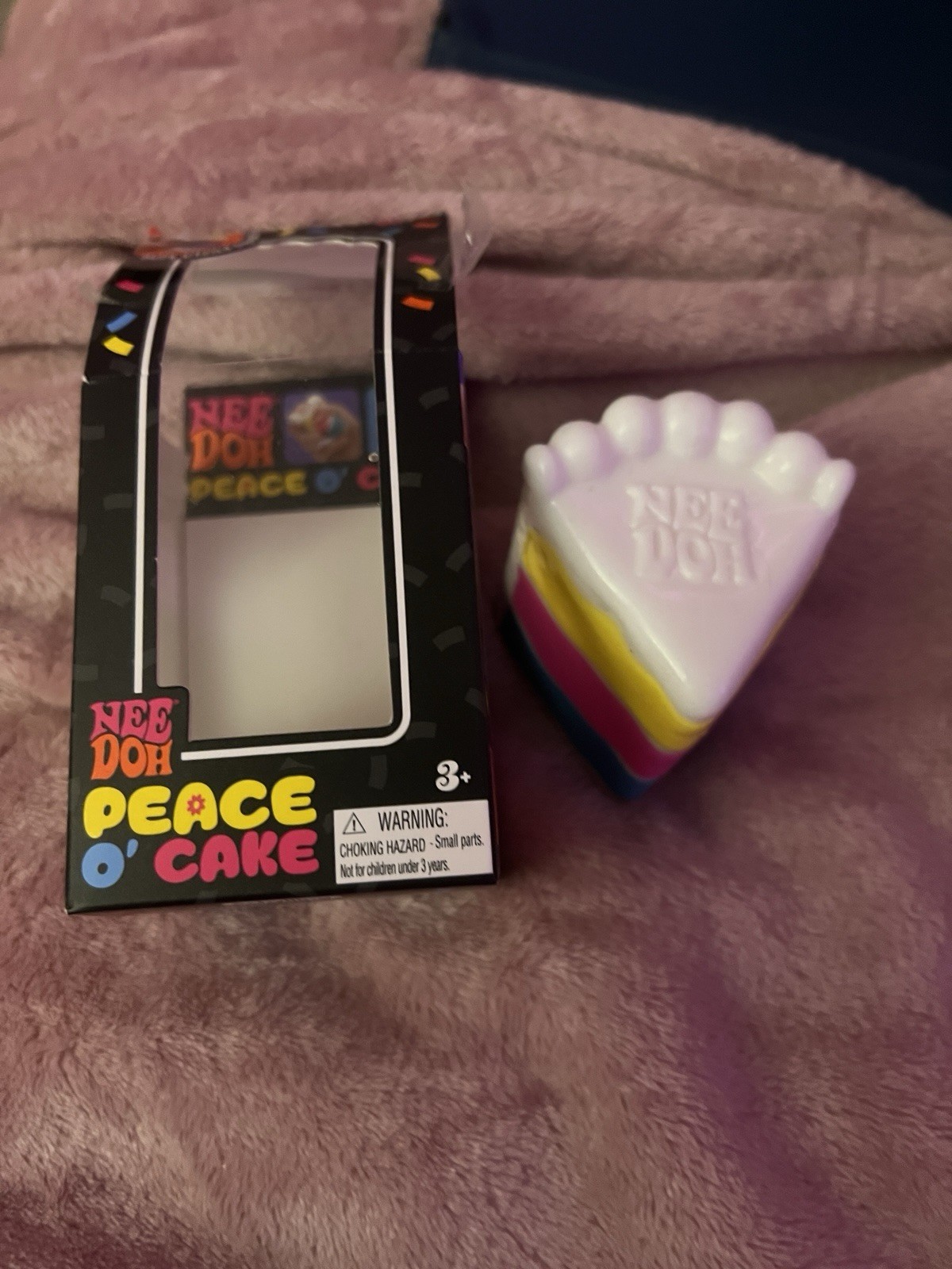 Nee Doh Peace O’ Cake Tactile Squeeze Toy Multicolor White Yellow Pink Blue
