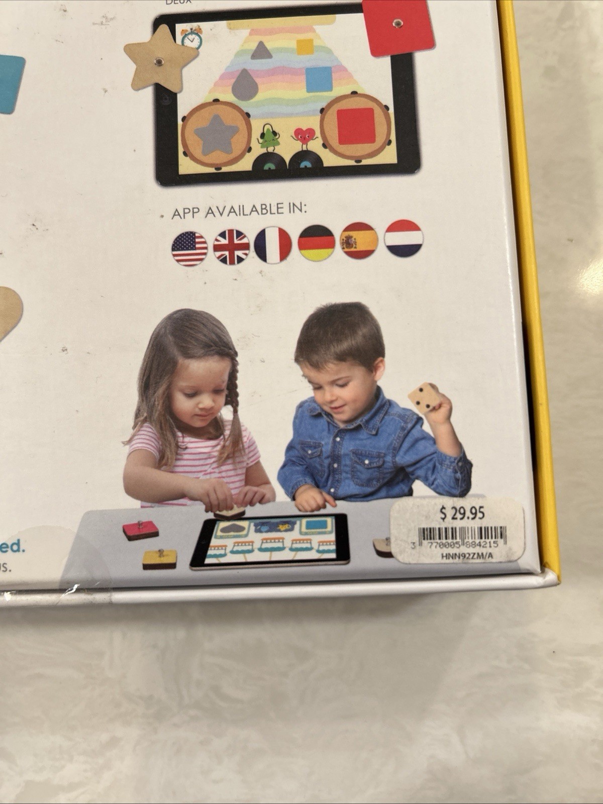 Marbotic Smart Shapes interactive learning toy with physical wooden shapes.