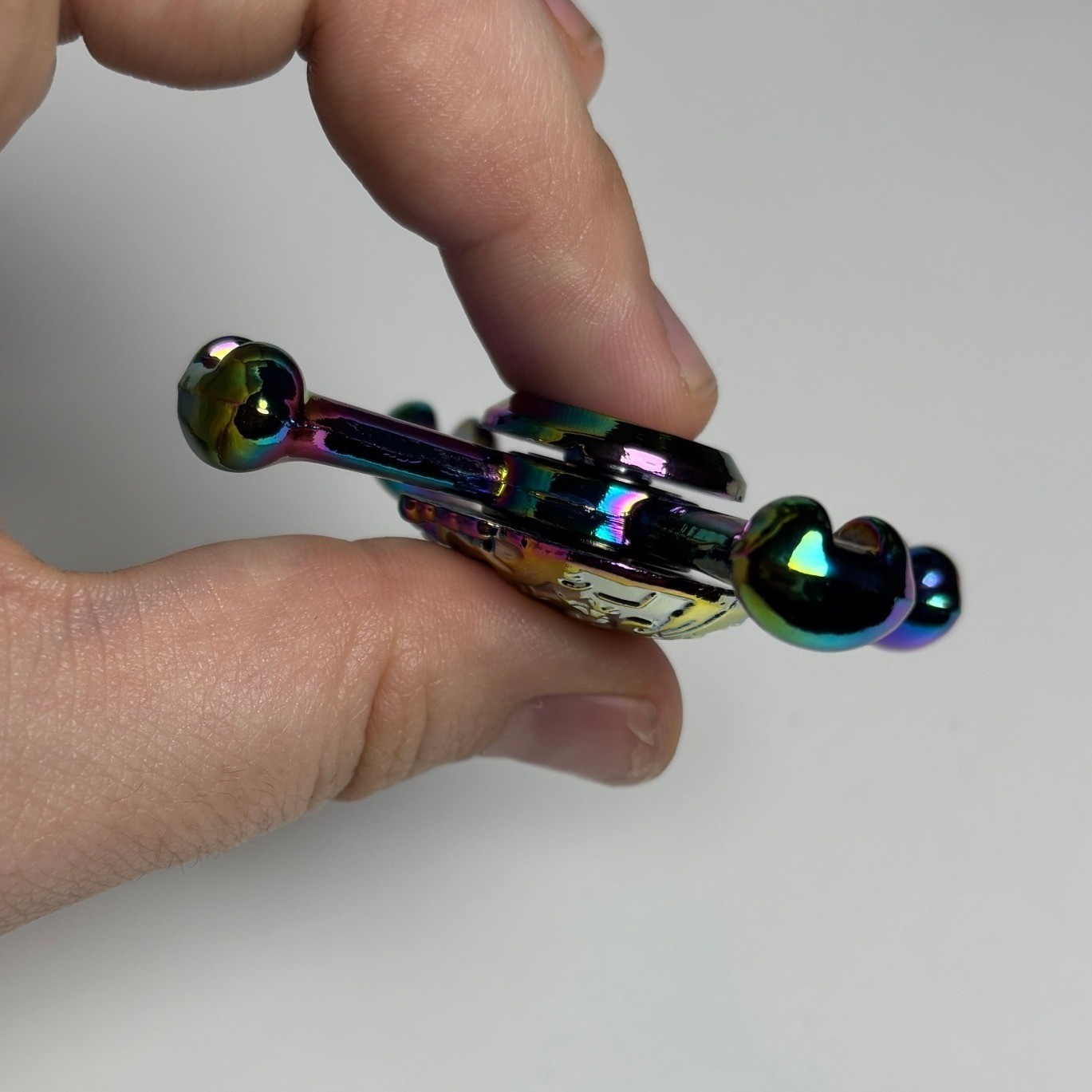 Iridescent Skull and Crossbones Metal Fidget Spinner Rainbow Oil Slick Finish