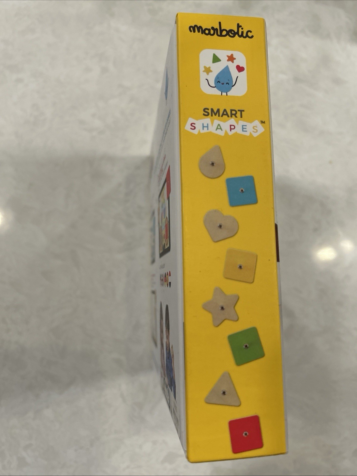 Marbotic Smart Shapes interactive learning toy with physical wooden shapes.
