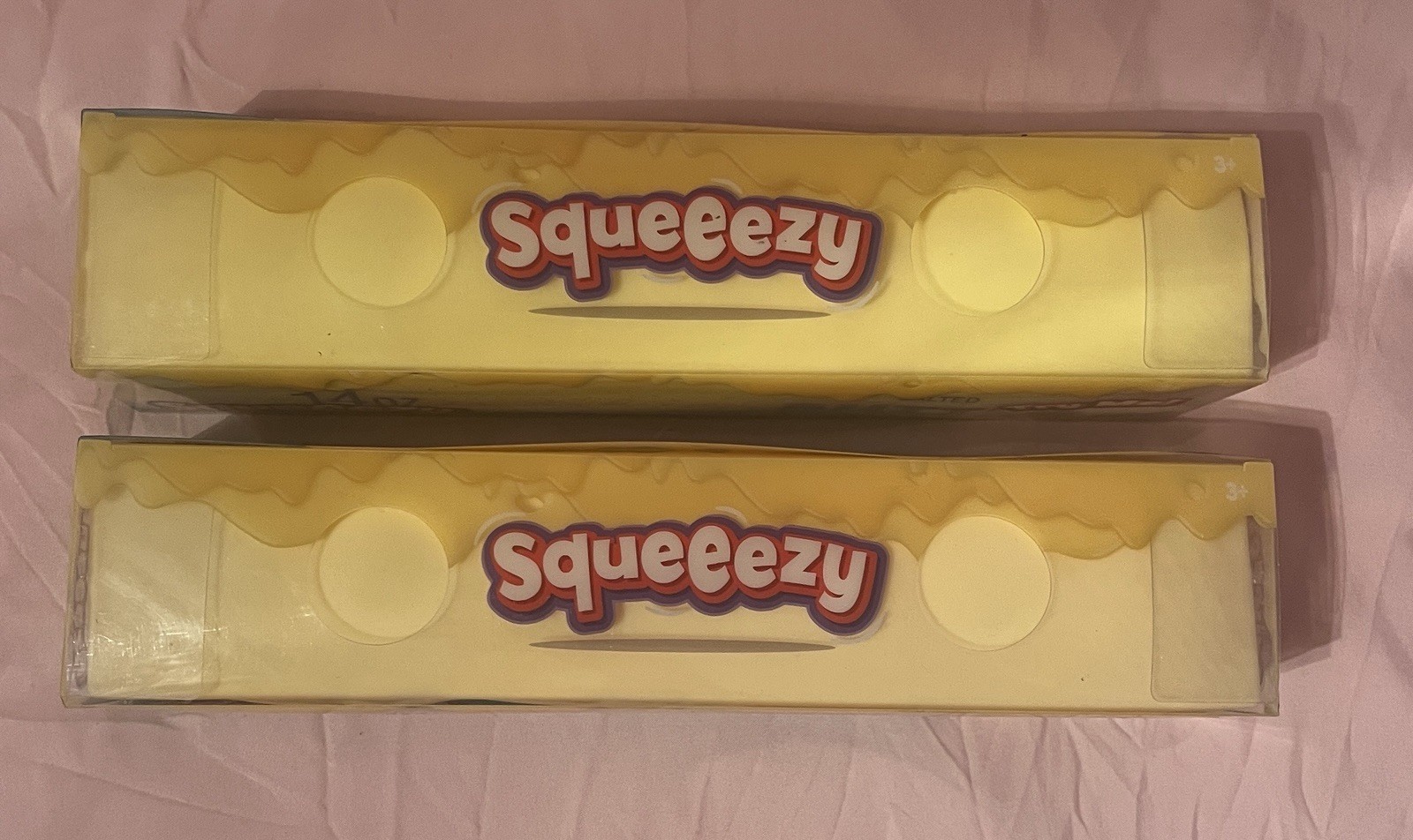 2 Viral Sunny Days Squeezy Butter Sticks.