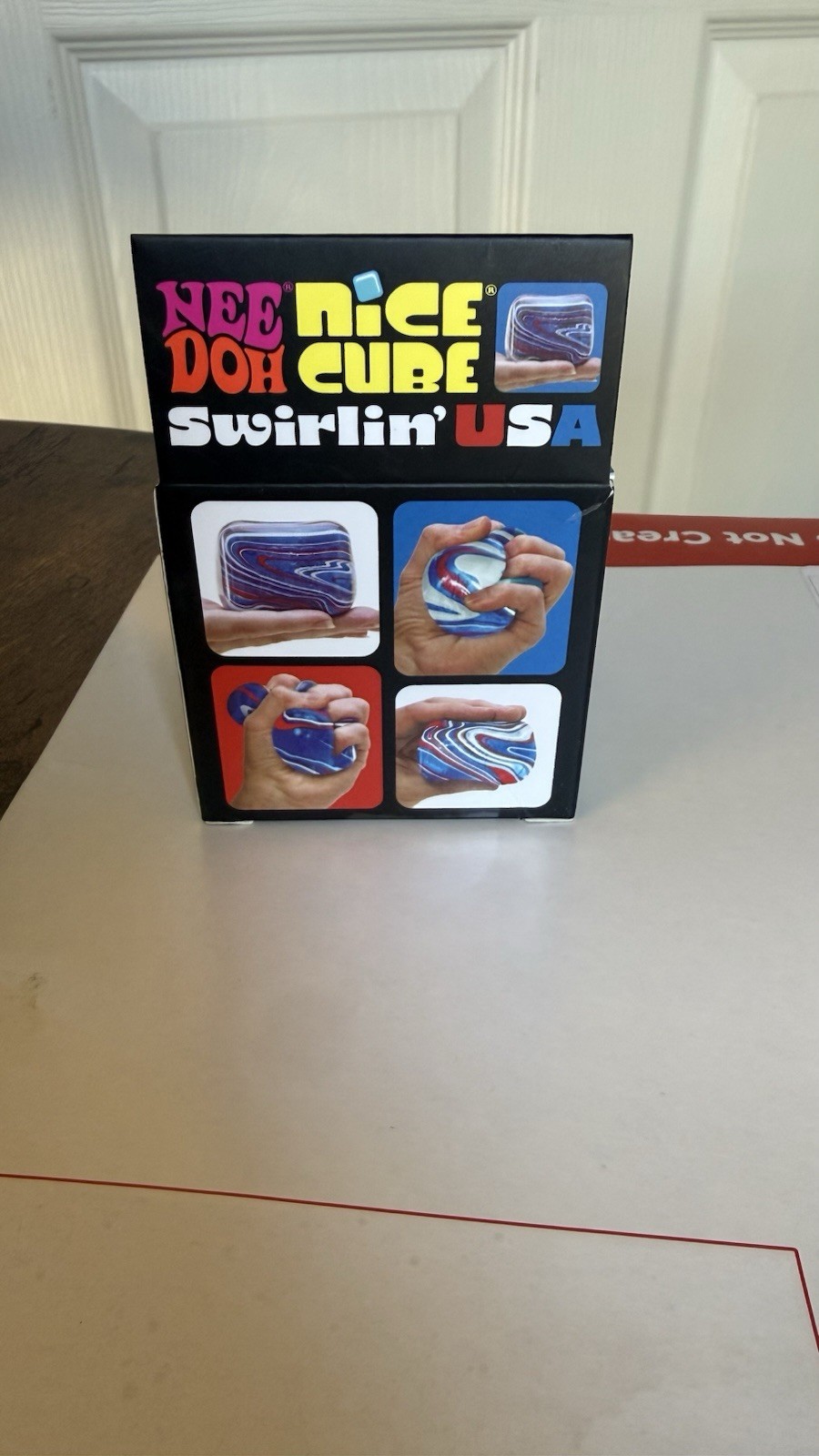 NeeDoh Nice Cube Swirlin’ USA Super Solid Squish Squeeze Toy, Red/White/Blue