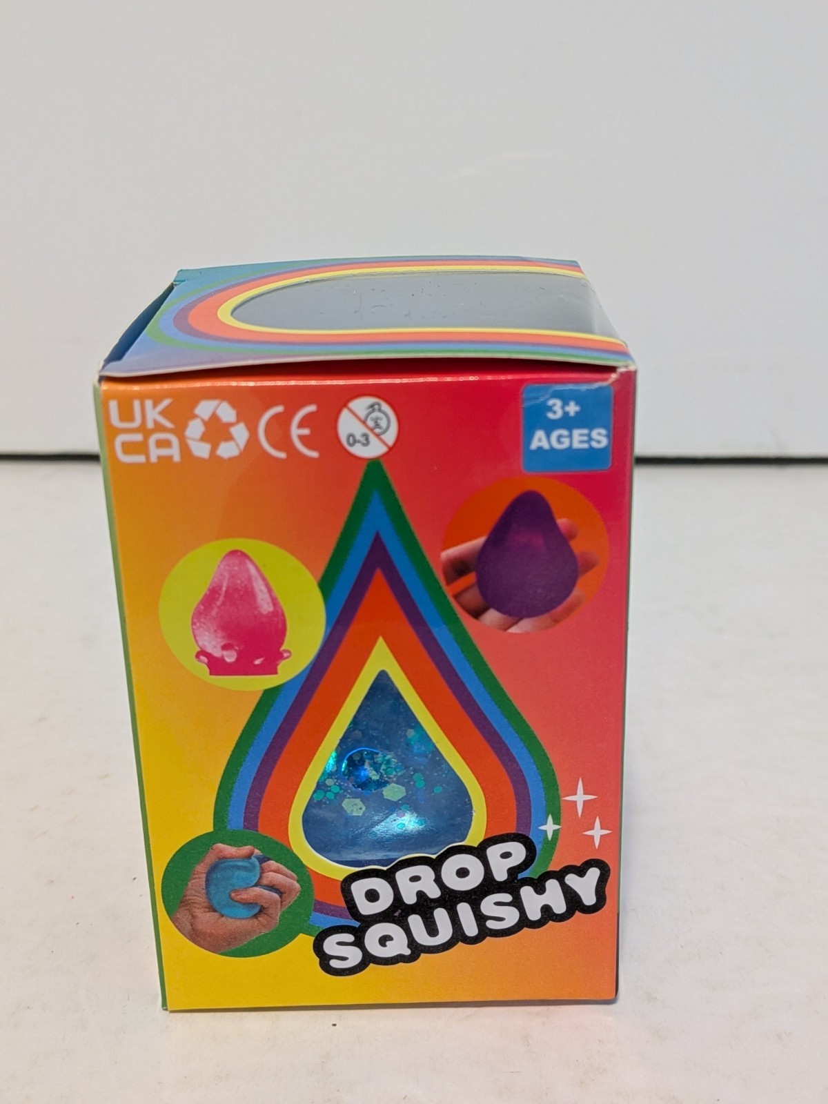 Drop Squishy Blue Glitter Tactile Squishy Squeeze Toy w/ Splash Display Stand