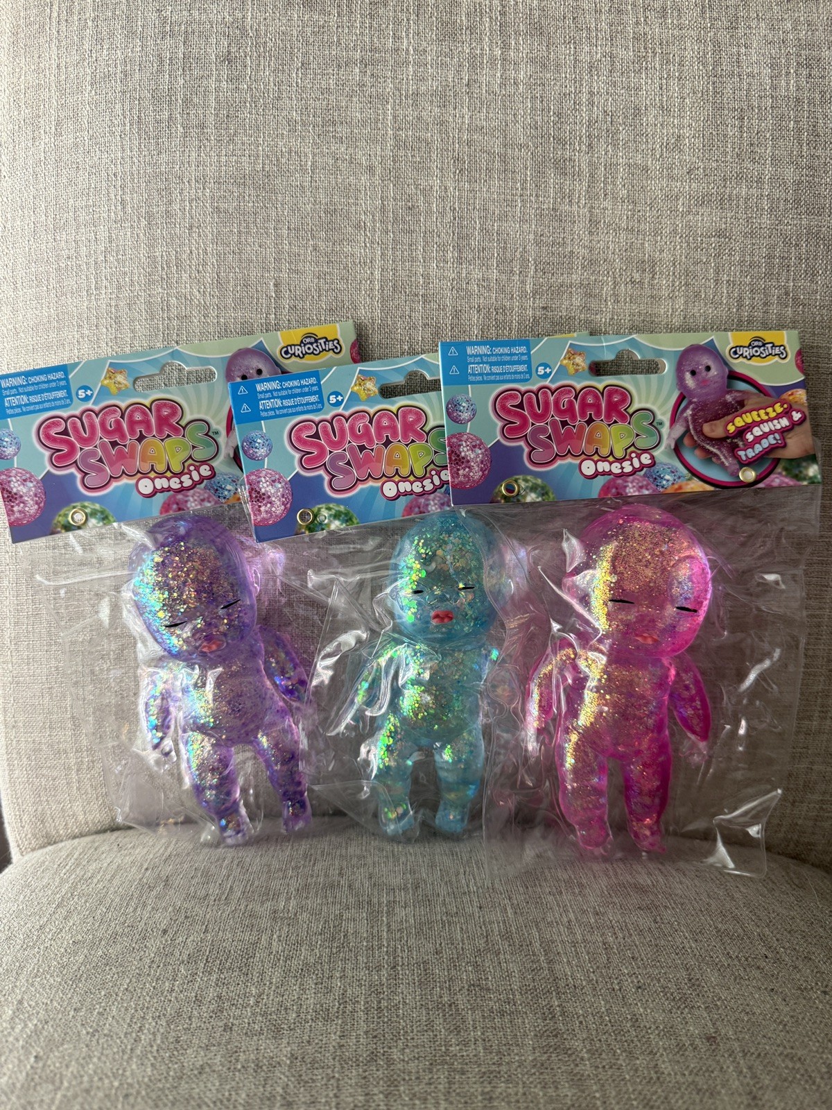 Lot Of 3 Sugar Swaps Baby Squishy Glitter Squeeze Toy 5” NEW Purple, Pink & Blue