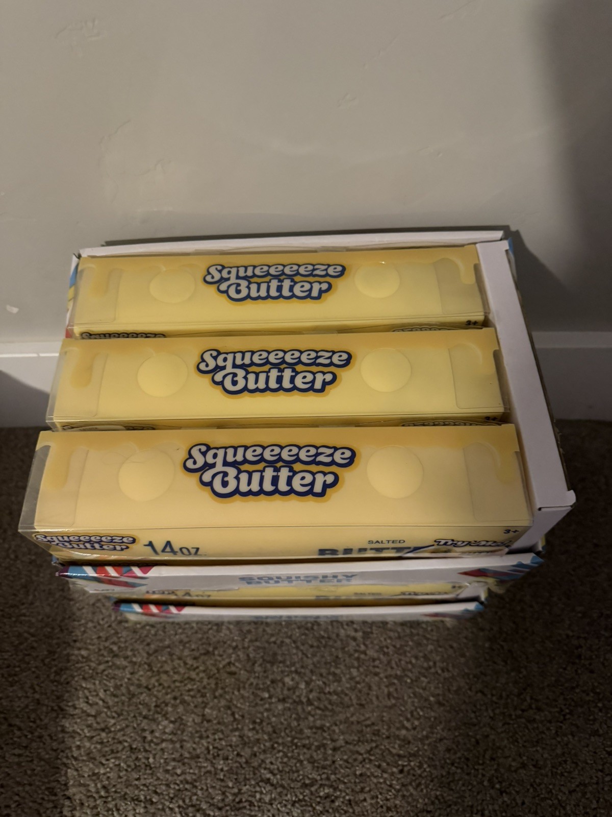 Case of 6 toymendous jumbo squishy butter in display case.