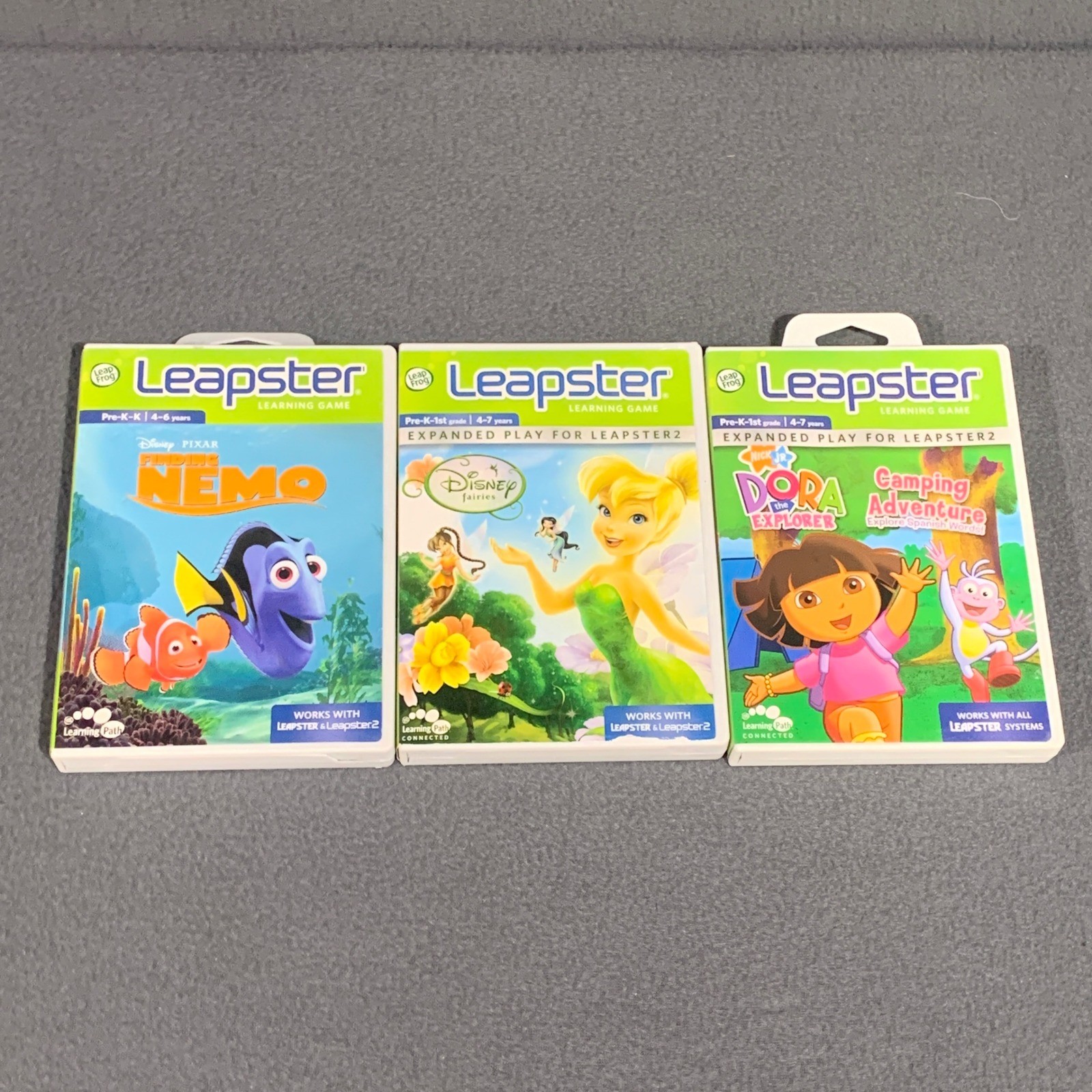 LeapFrog Leapster Games Lot of 3 Finding Nemo Disney Fairies Dora Explorer Case