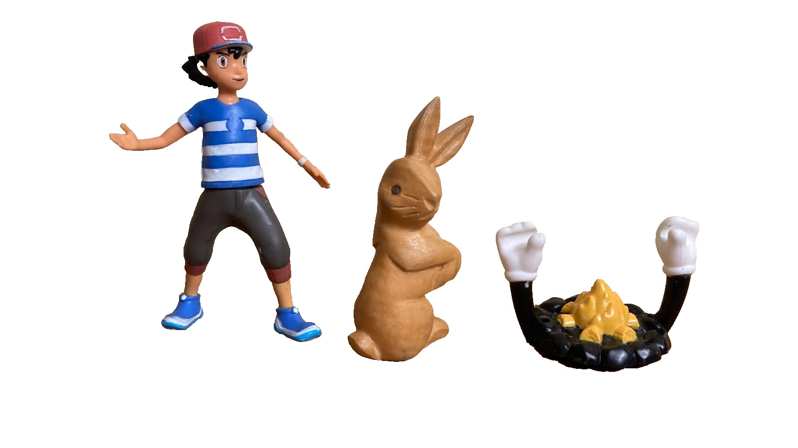 Dozen sand tray figure miniatures address ideas of childhood, danger, and safety