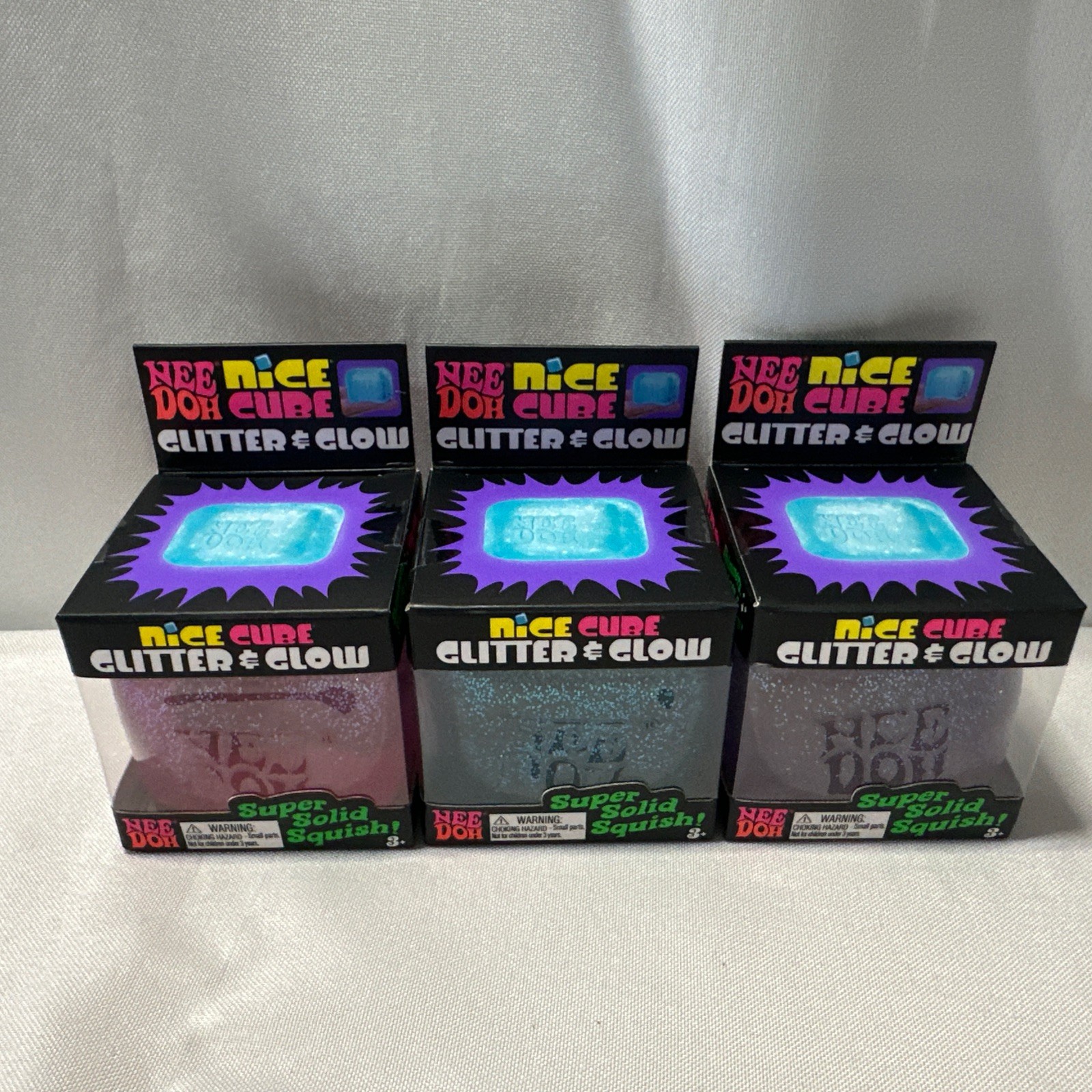 Lot Of 3 NeeDoh Nice Cube Glitter Glow Purple Pink Blue Squishy Toy Nee-Doh NIB