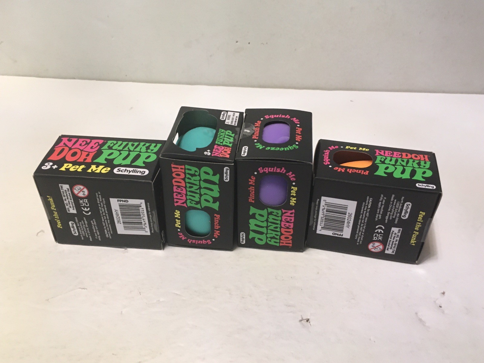 NeeDoh Schylling Funky Pup Fidget Toy Lot of 4 Pink Purple Teal & Orange