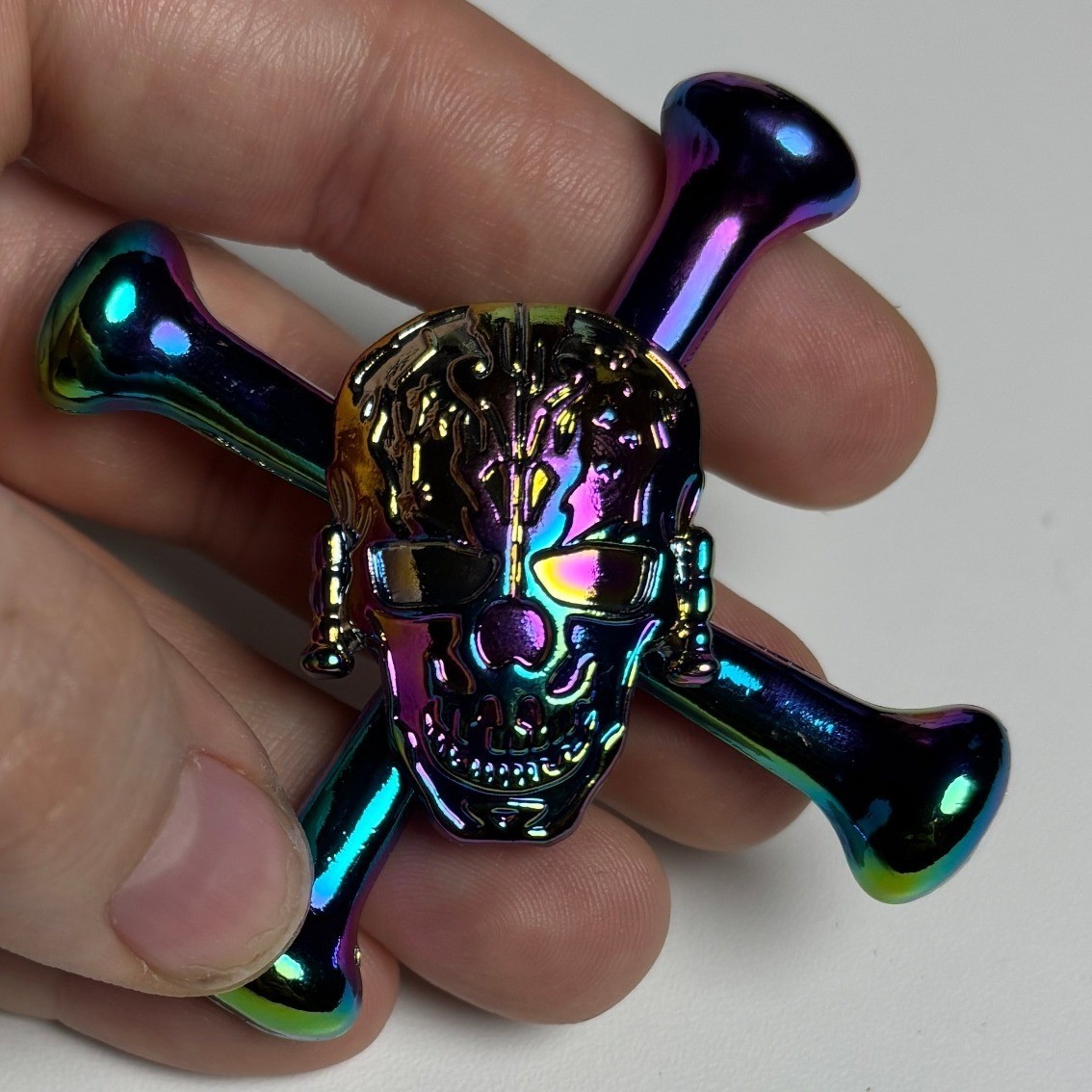 Iridescent Skull and Crossbones Metal Fidget Spinner Rainbow Oil Slick Finish